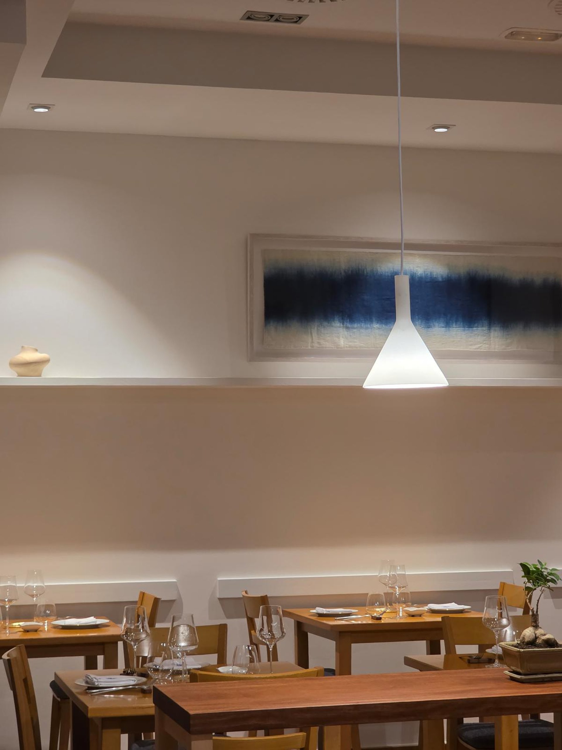 woman wearing yellow long-sleeved dress under white clouds and blue sky during daytime