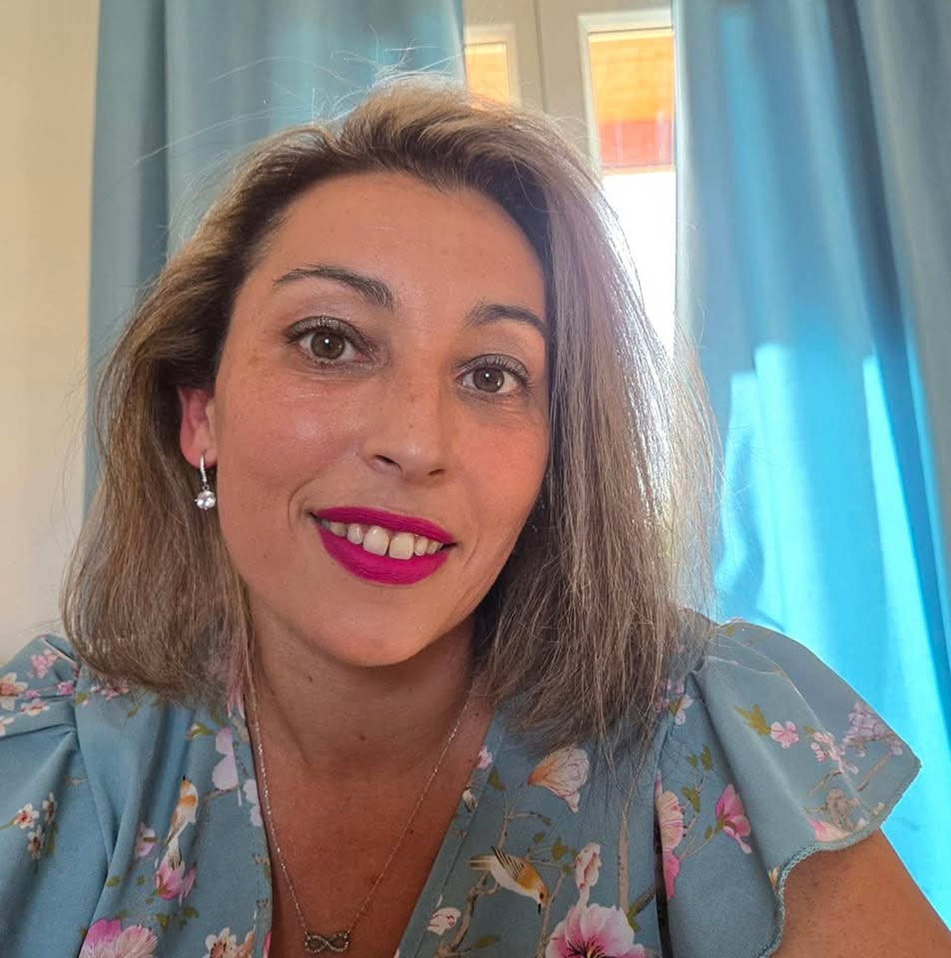 woman wearing yellow long-sleeved dress under white clouds and blue sky during daytime