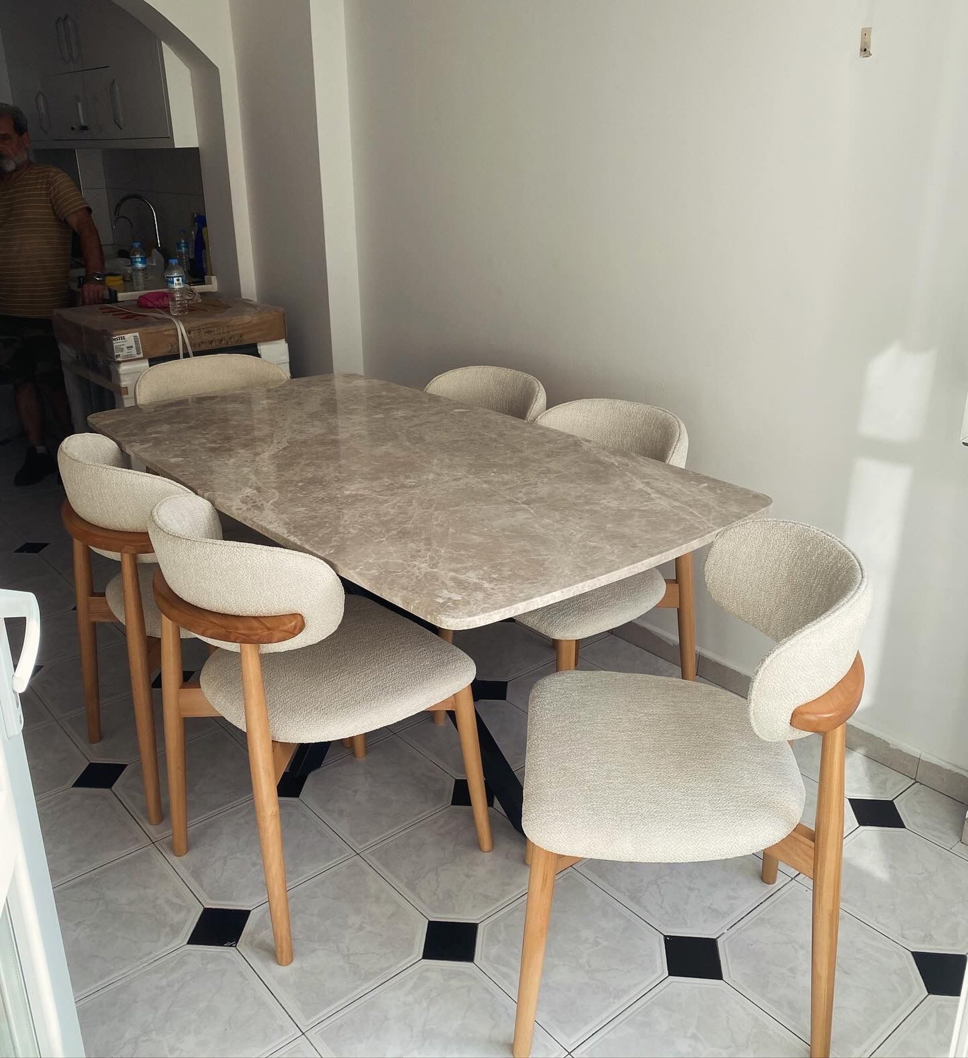 a couple of couches sitting on top of a wooden floor