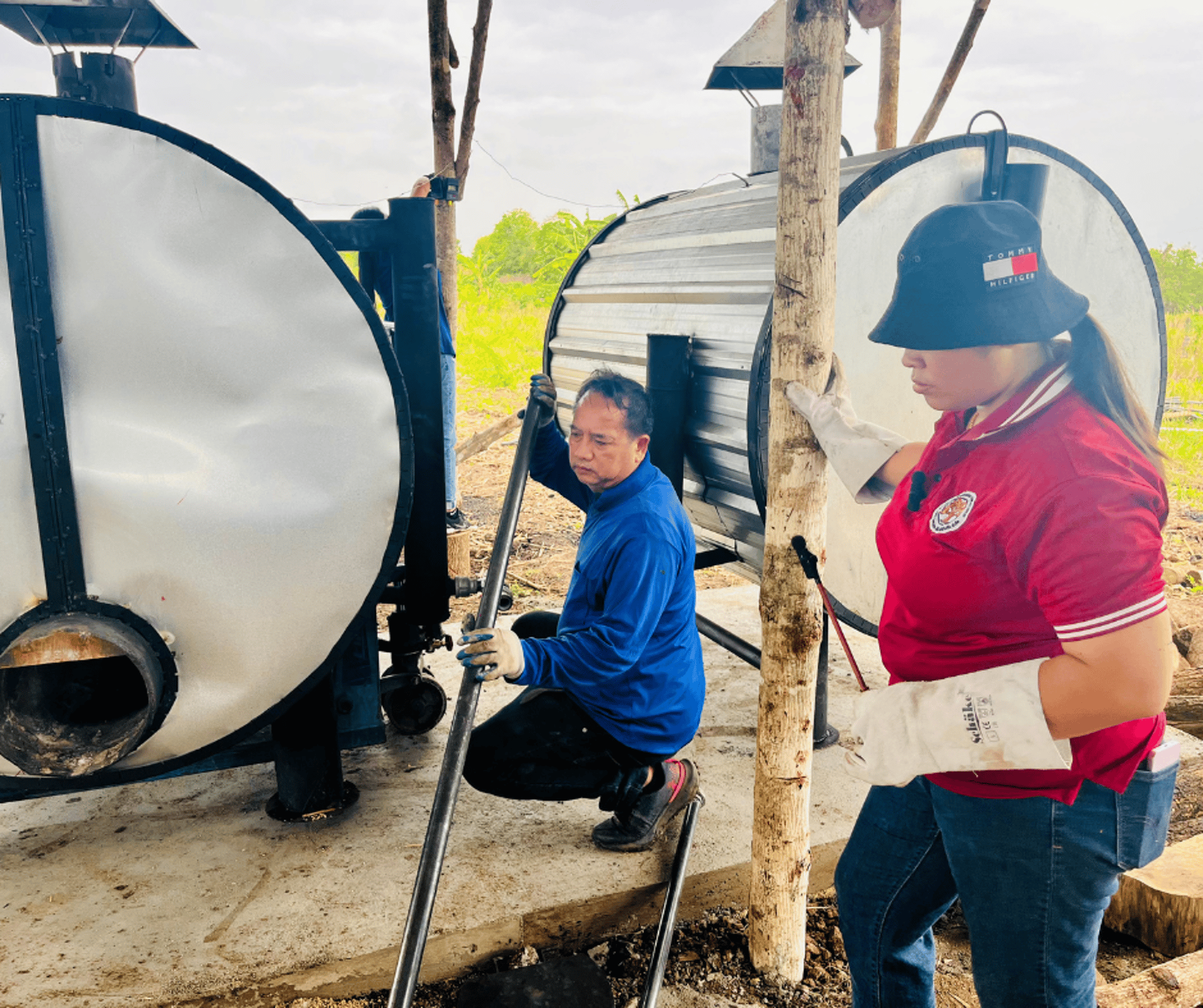 green and white tractor on green grass field during daytime