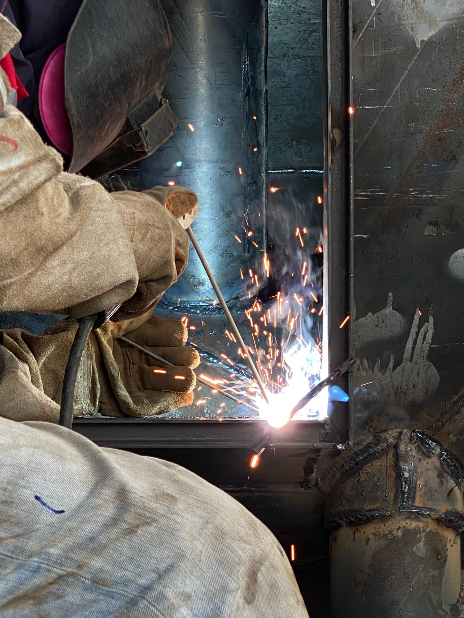 green and white tractor on green grass field during daytime