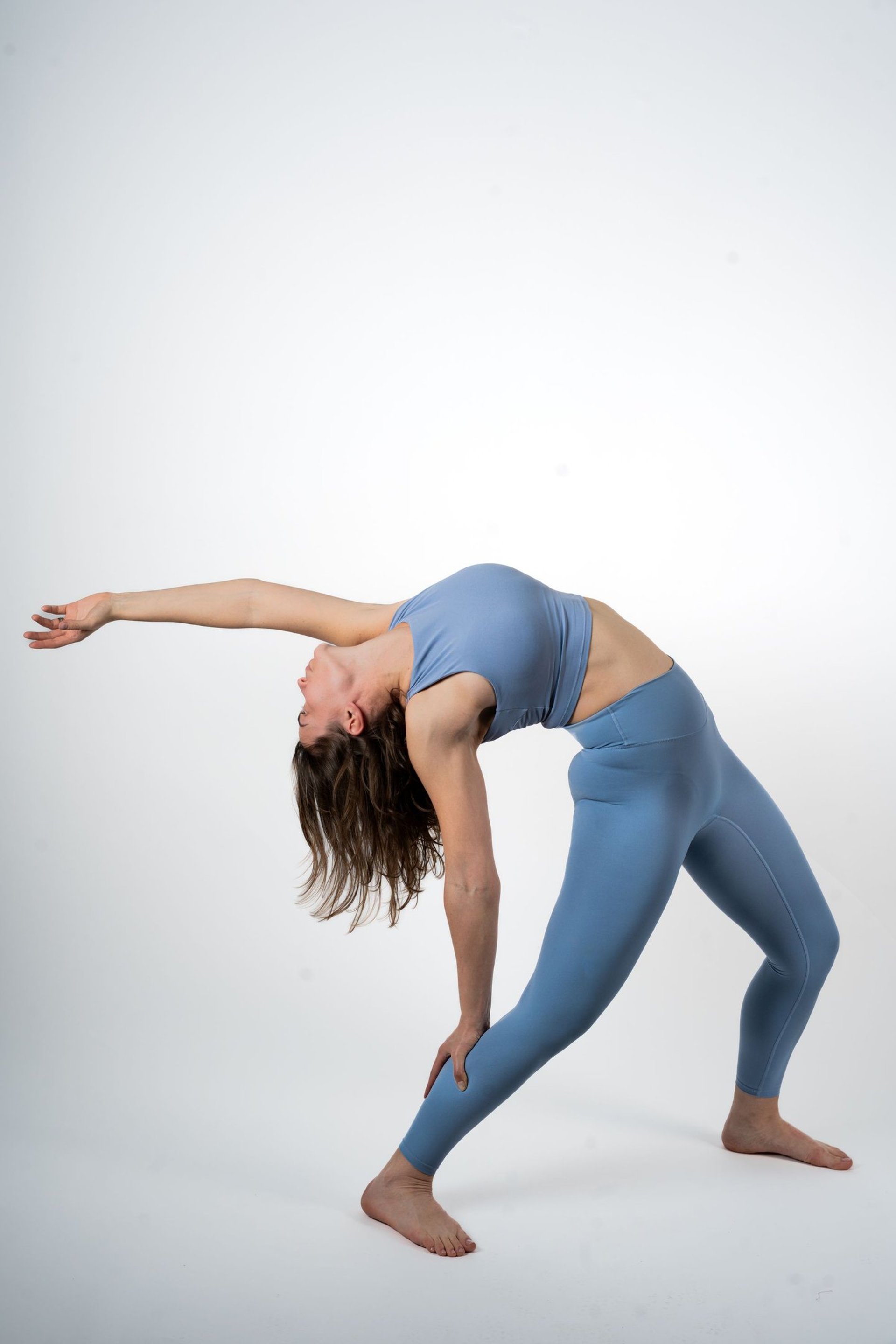 woman wearing yellow long-sleeved dress under white clouds and blue sky during daytime