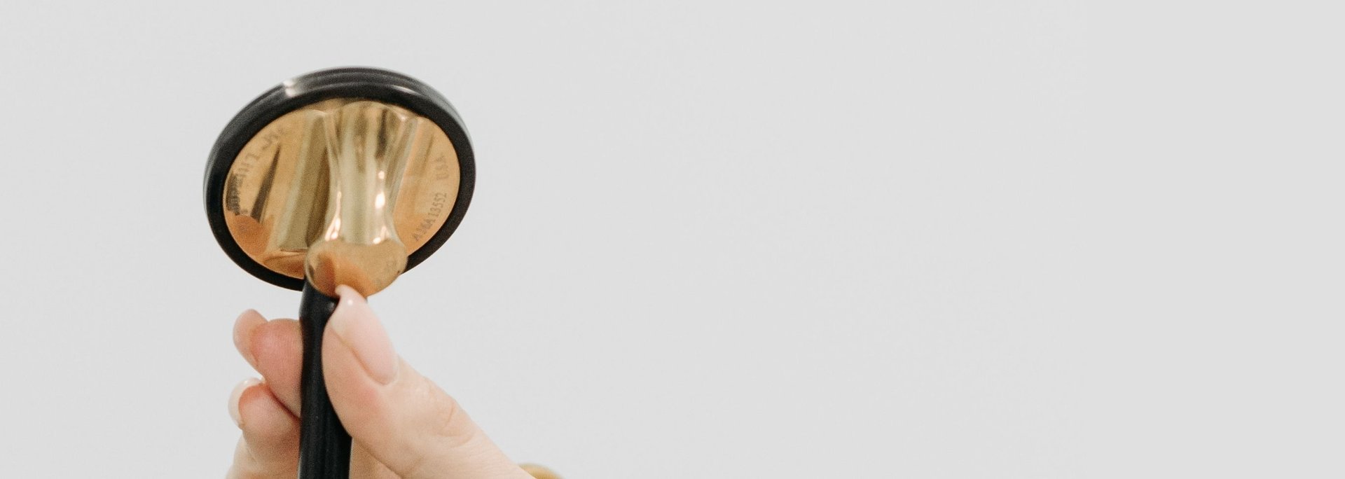 an abstract photo of a curved building with a blue sky in the background