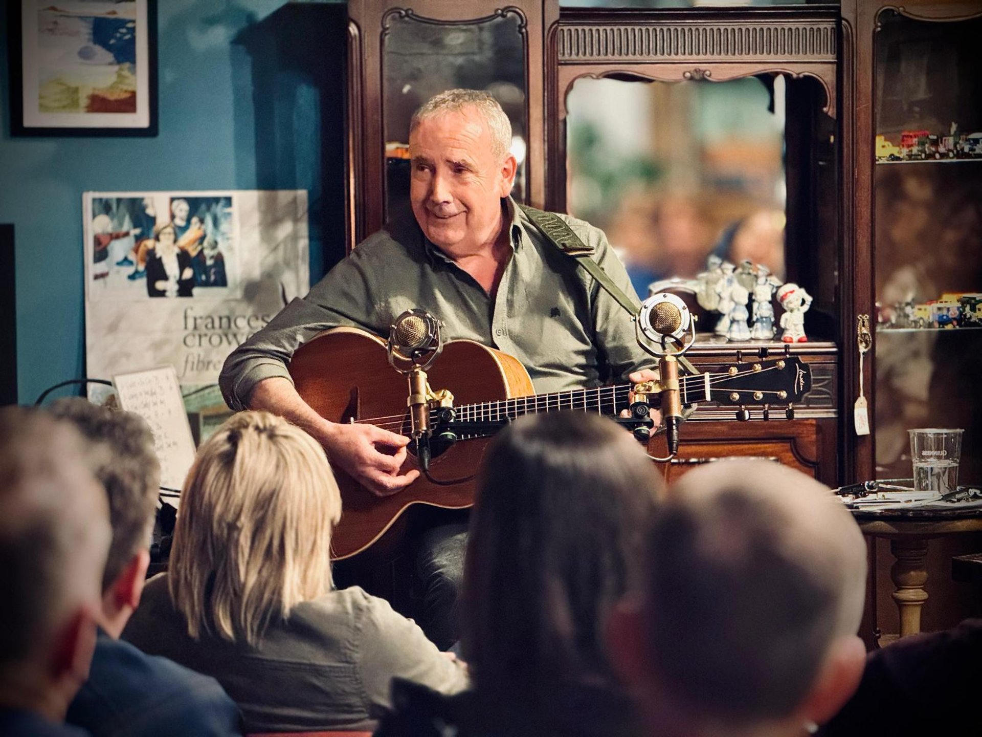 person wearing grey knit sweater