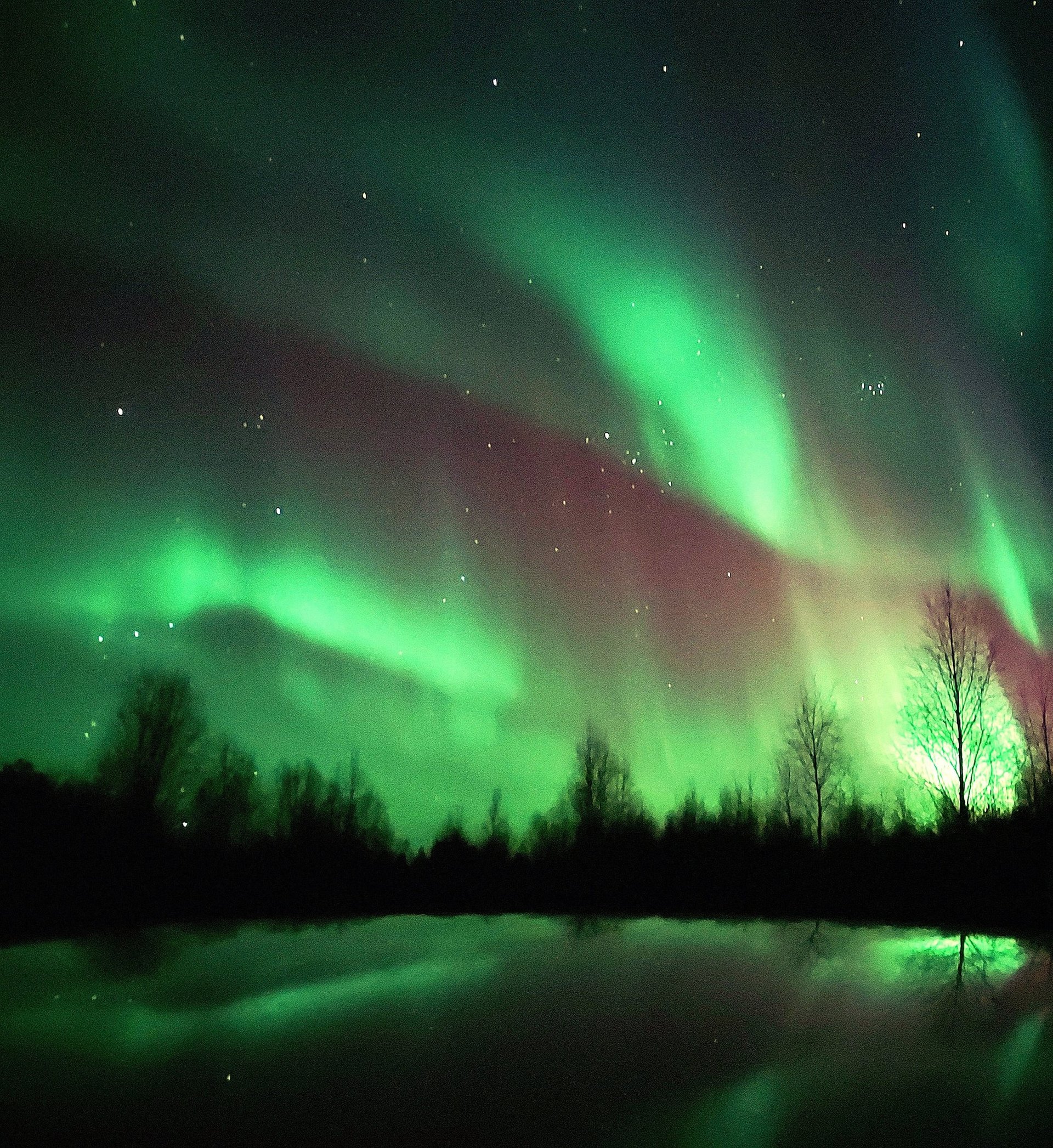 snow-covered mountain near lake under blue sky