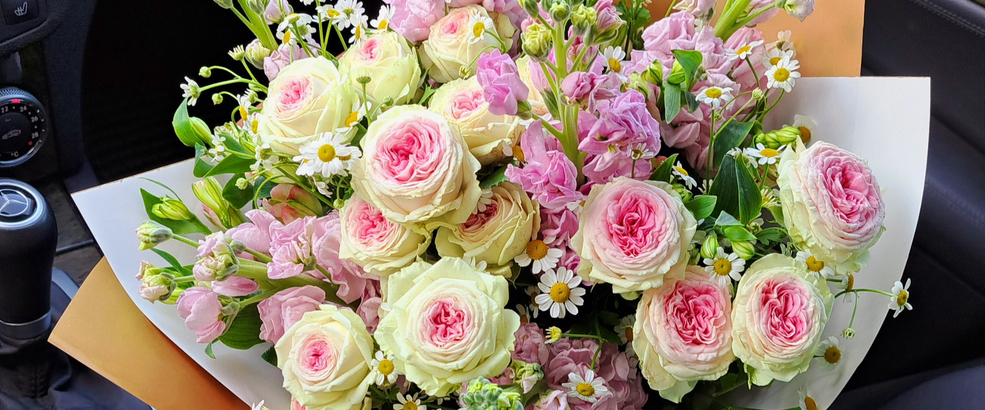 an abstract photo of a curved building with a blue sky in the background