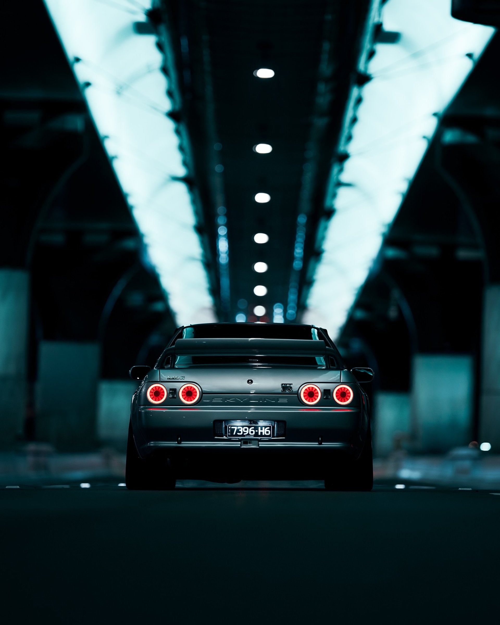a silhouette of a man holding a baseball bat