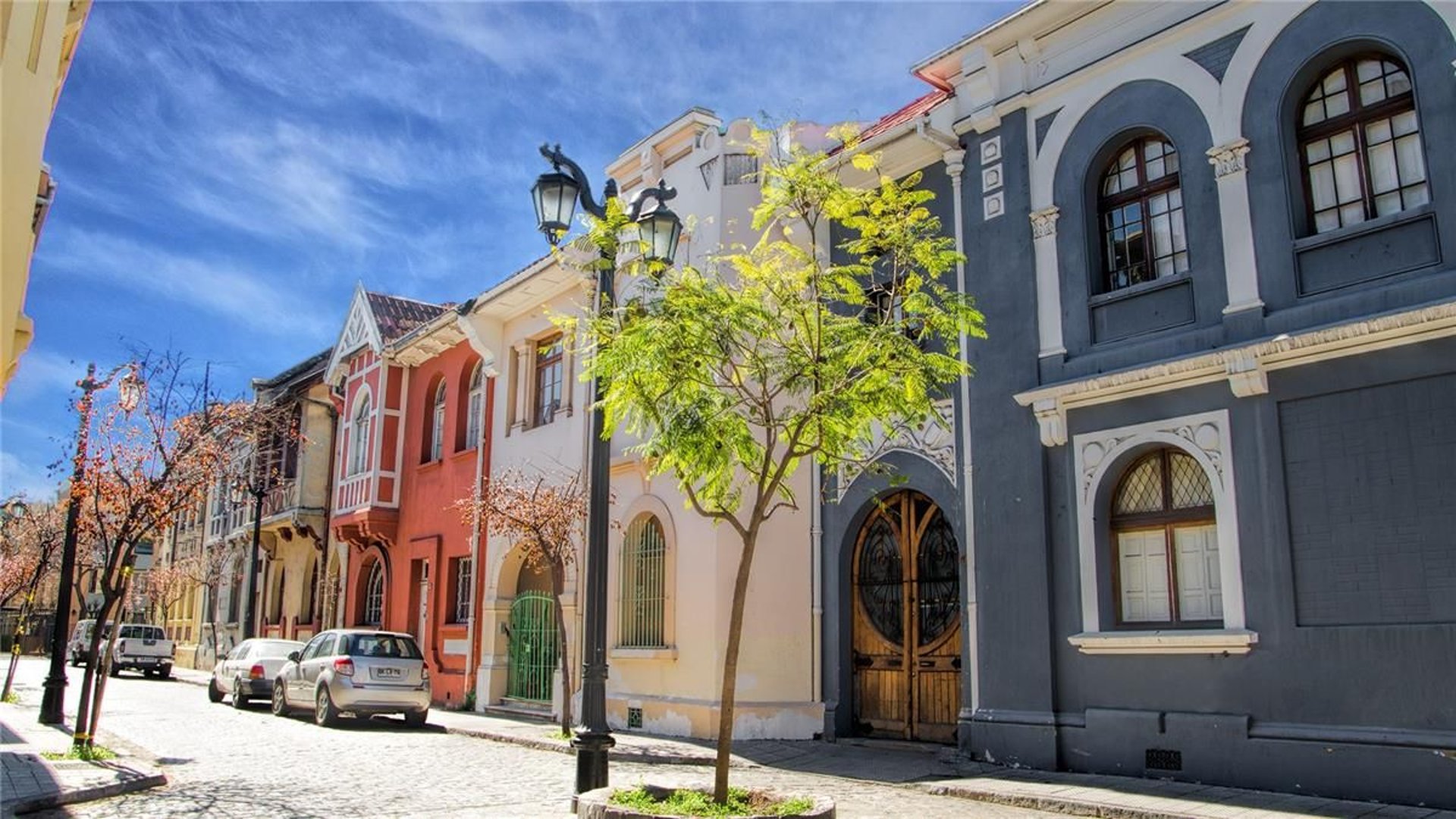 an abstract photo of a curved building with a blue sky in the background