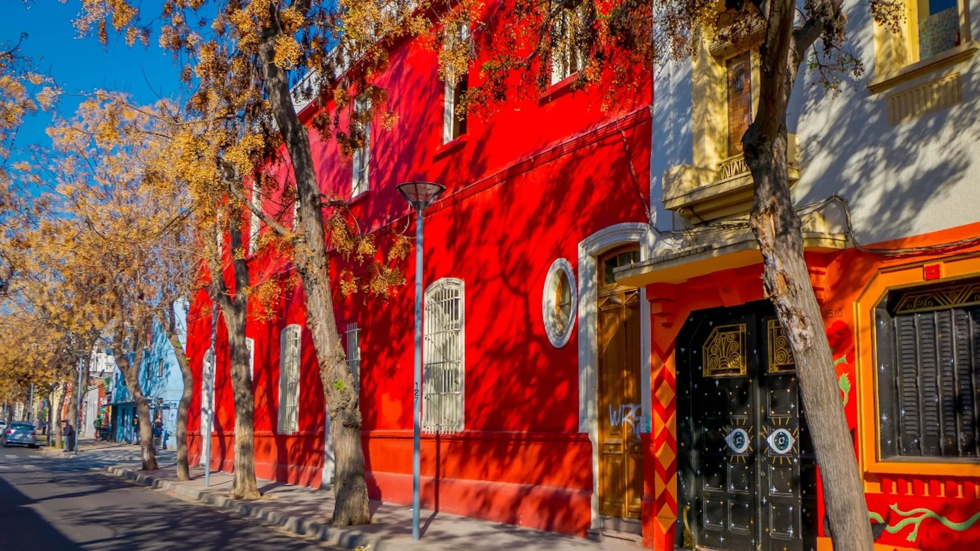 woman wearing yellow long-sleeved dress under white clouds and blue sky during daytime