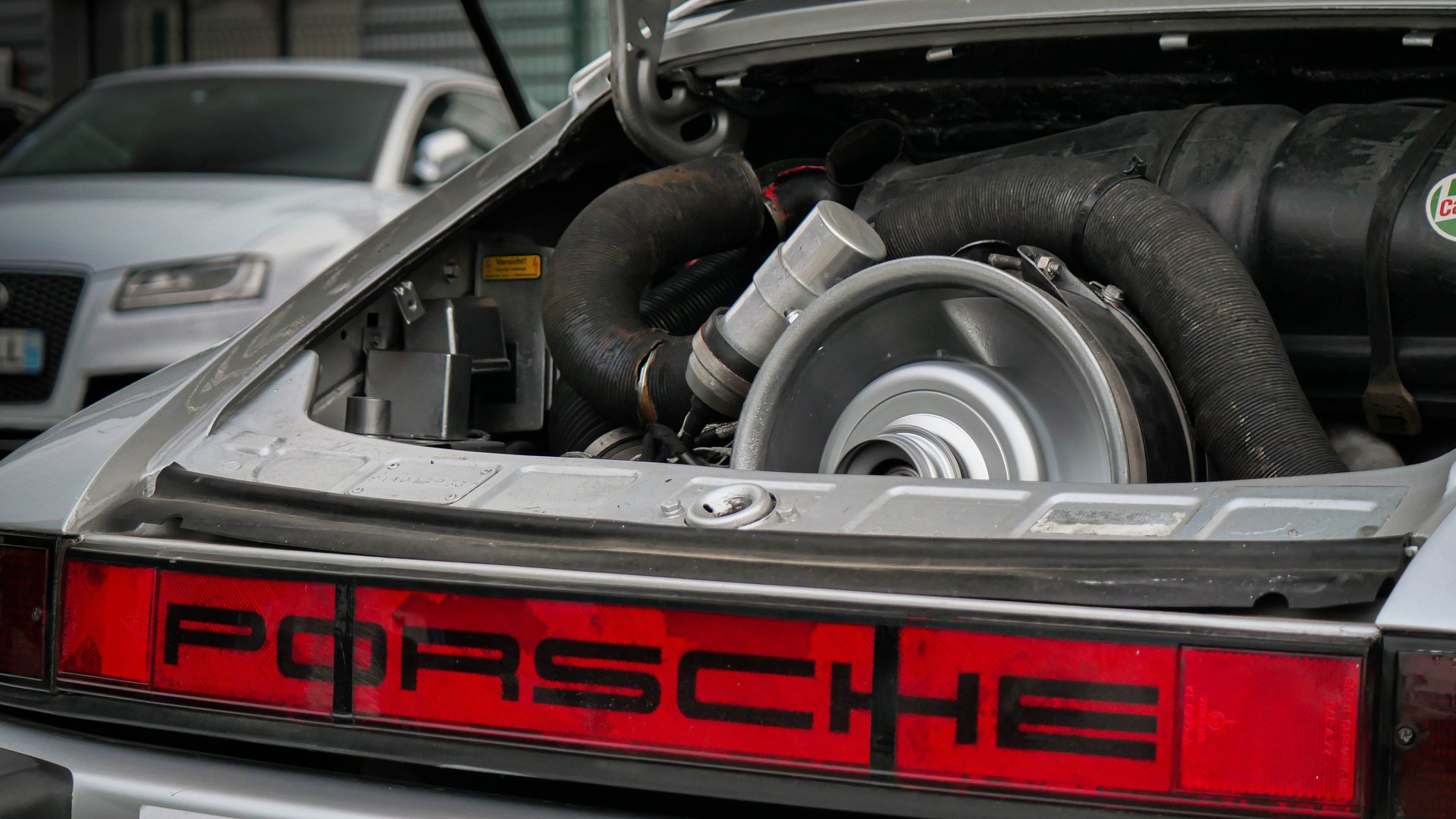 an abstract photo of a curved building with a blue sky in the background