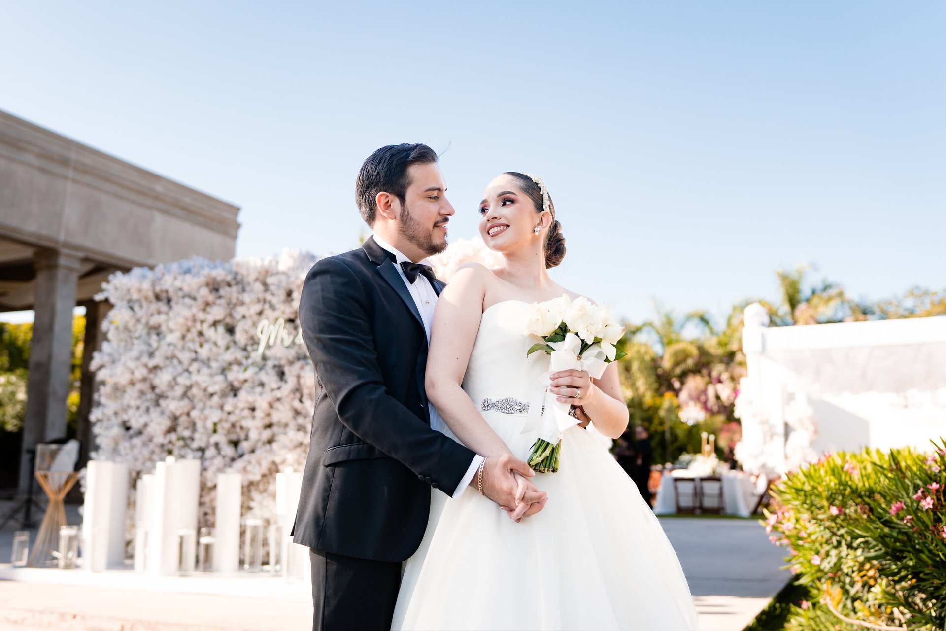 an abstract photo of a curved building with a blue sky in the background