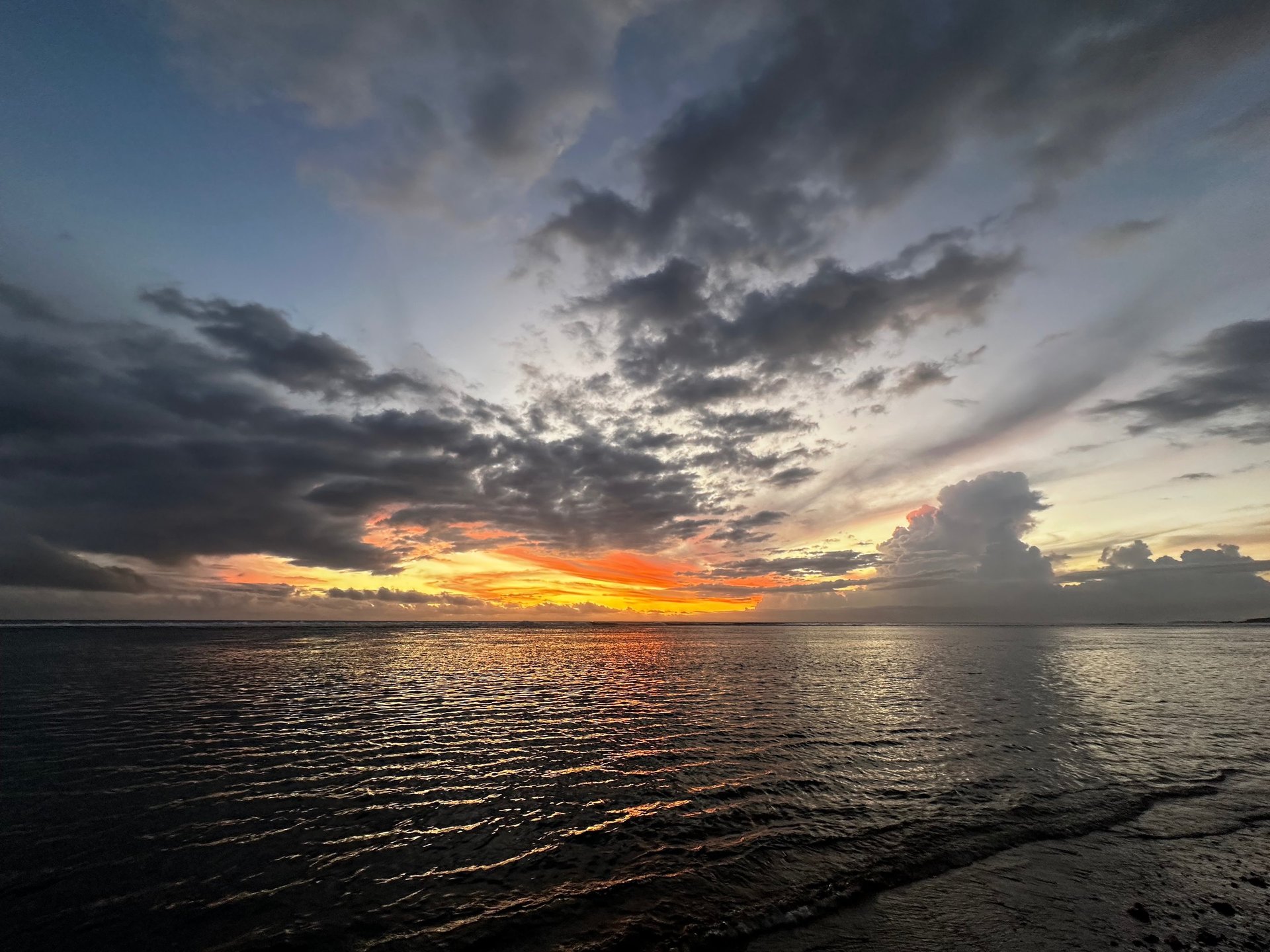 woman wearing yellow long-sleeved dress under white clouds and blue sky during daytime