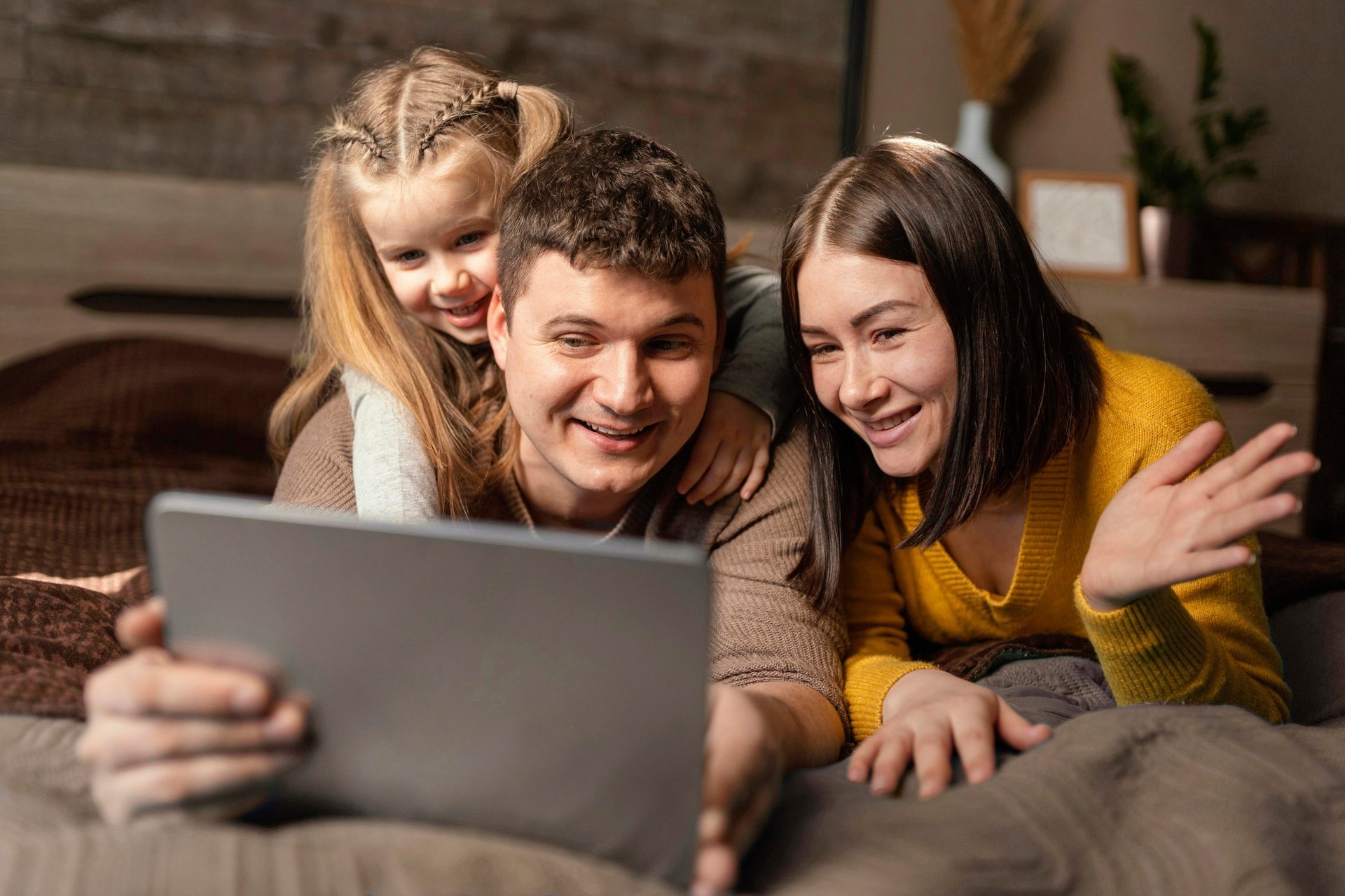 a person sitting on a couch with a laptop