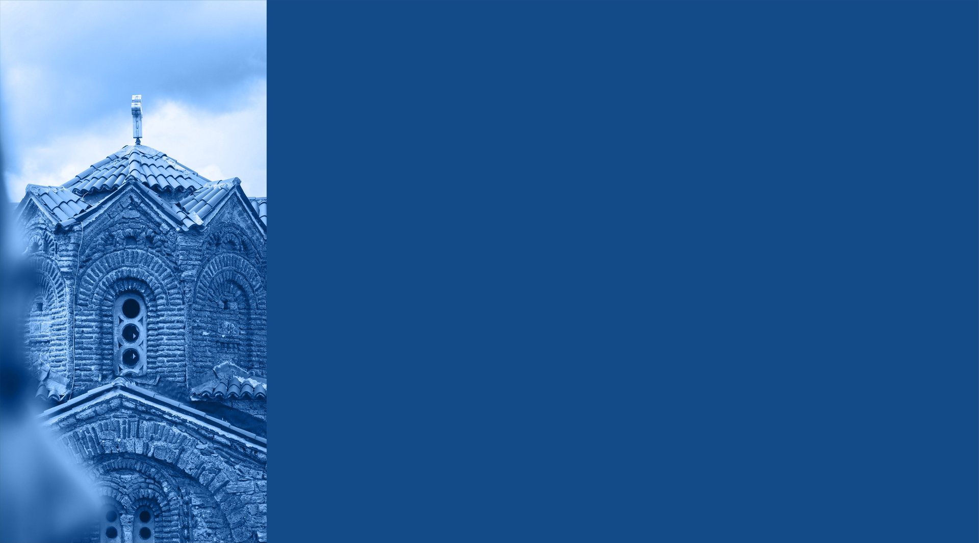 an abstract photo of a curved building with a blue sky in the background