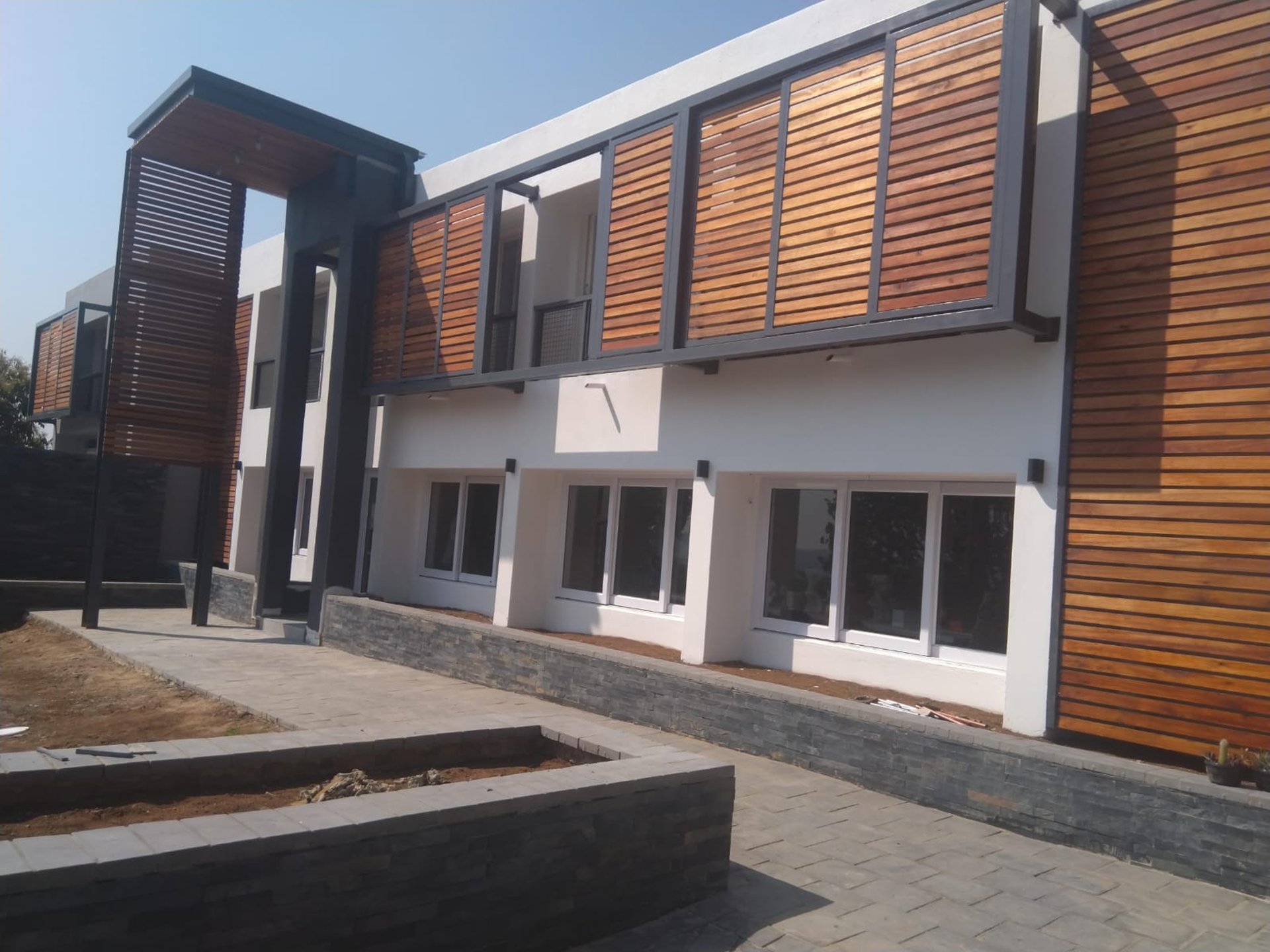 black and brown leather padded tub sofa