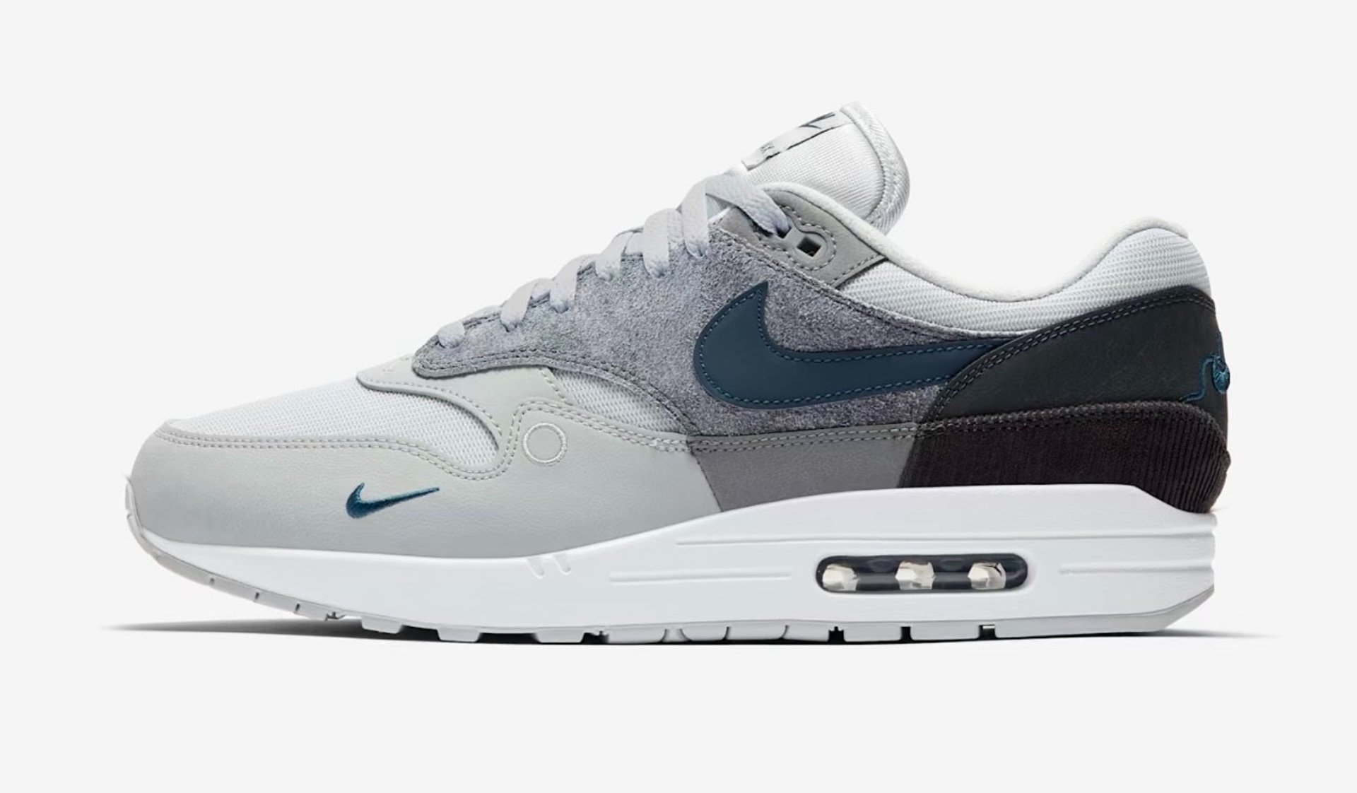 Nike Air Max 1 'London' sneaker in Urban Grey with Sail midsole, gum outsole, and deconstructed Swoosh design