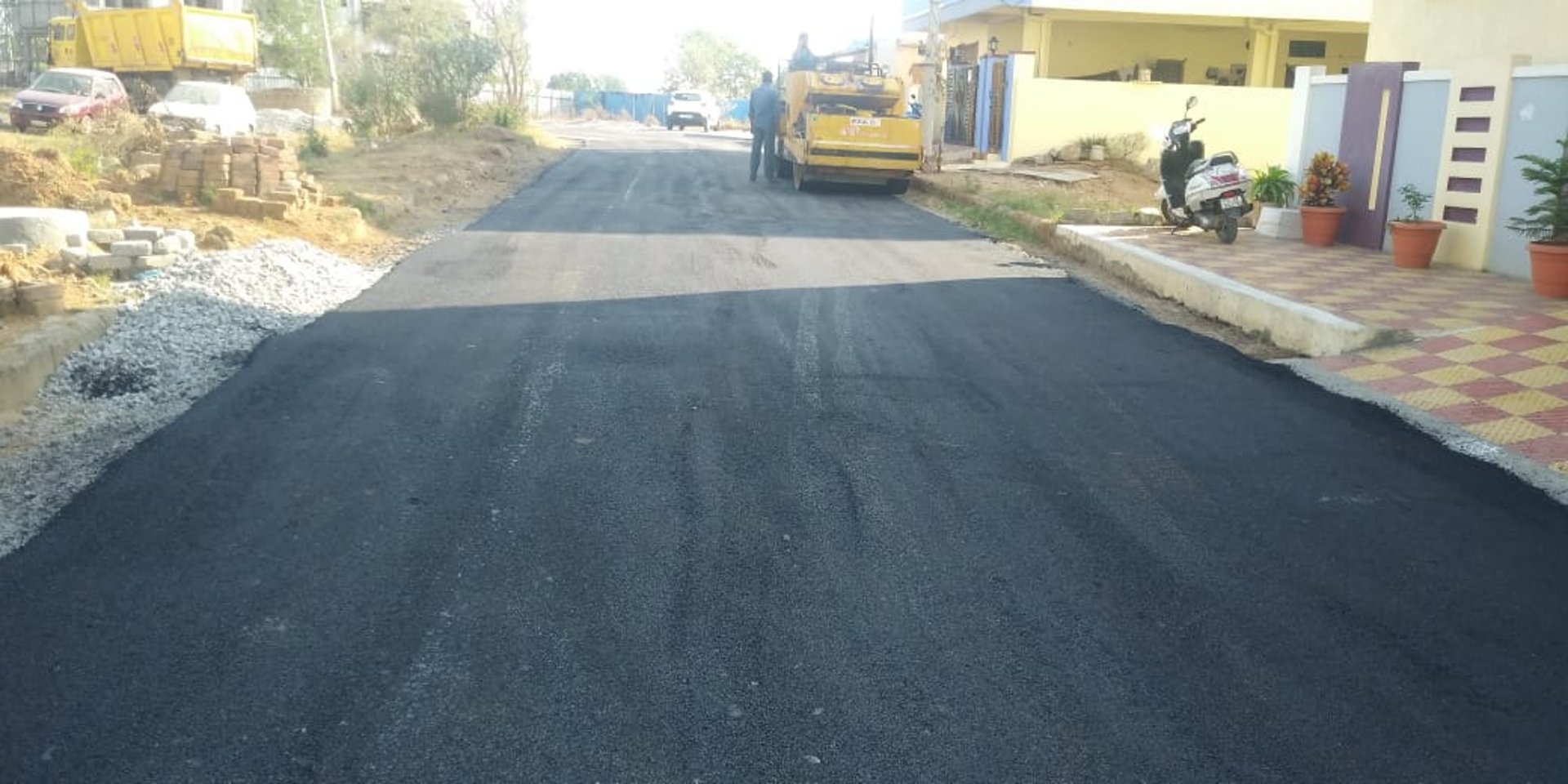 woman wearing yellow long-sleeved dress under white clouds and blue sky during daytime