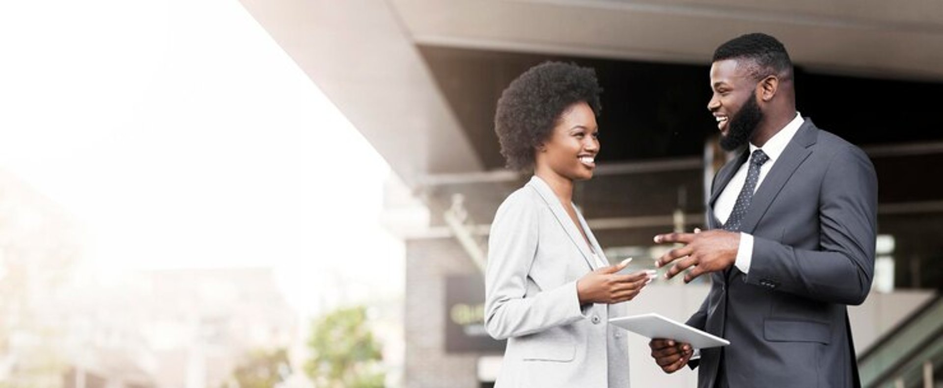an abstract photo of a curved building with a blue sky in the background