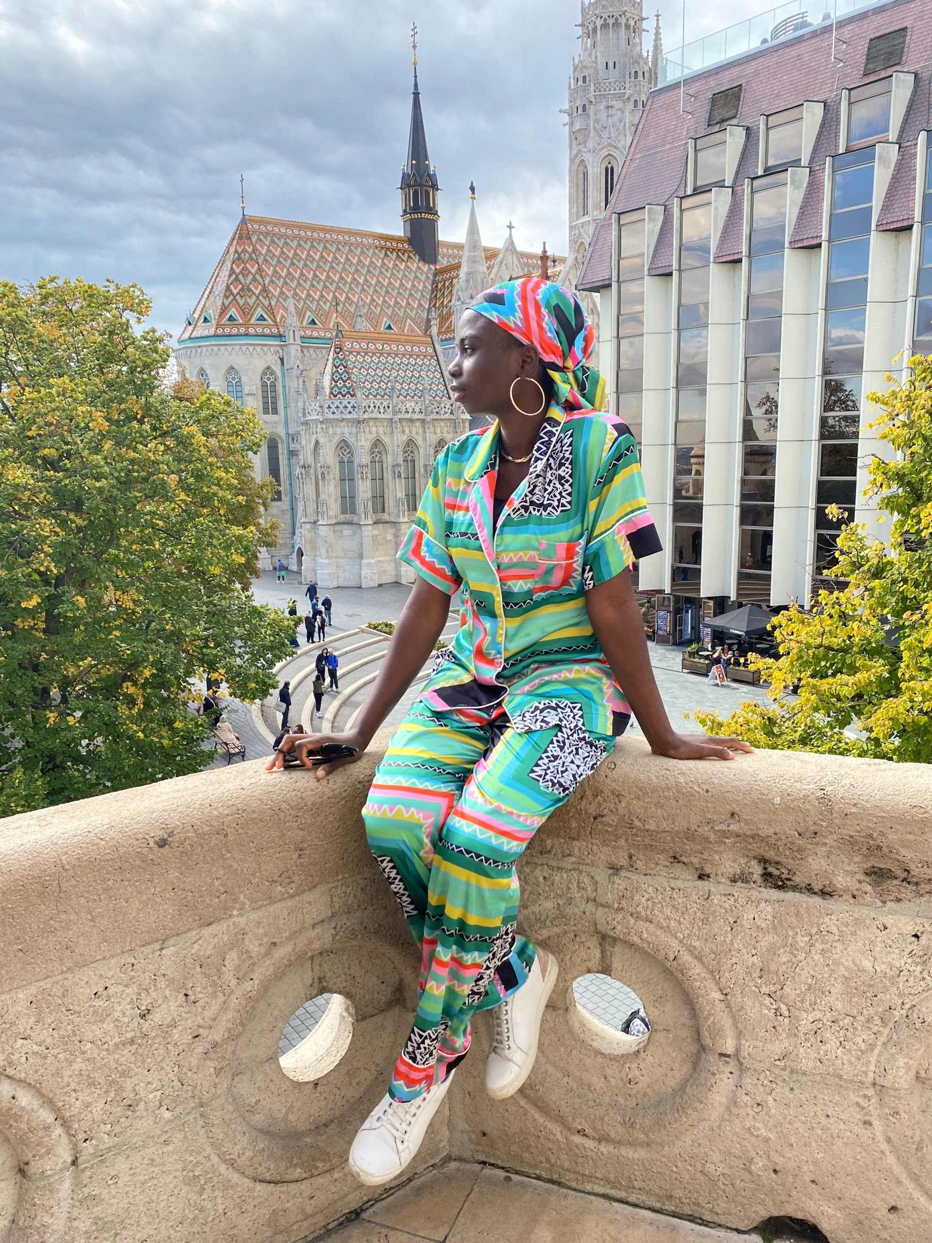 an abstract photo of a curved building with a blue sky in the background