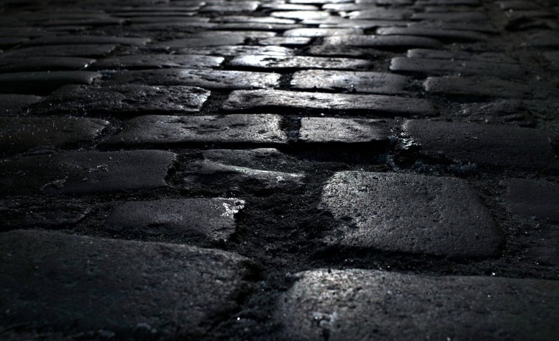 an abstract photo of a curved building with a blue sky in the background