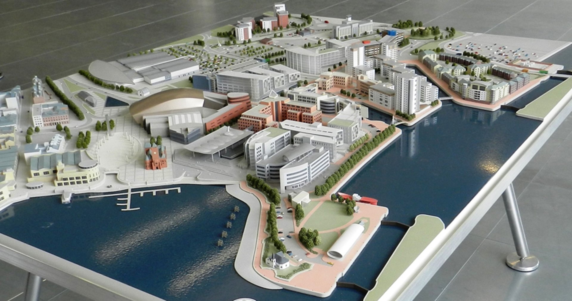 a model of a city with buildings and cars