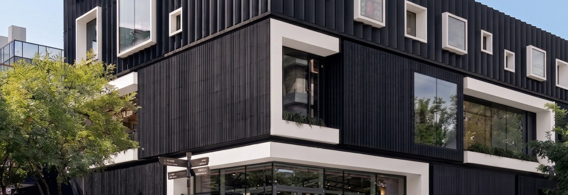 an abstract photo of a curved building with a blue sky in the background