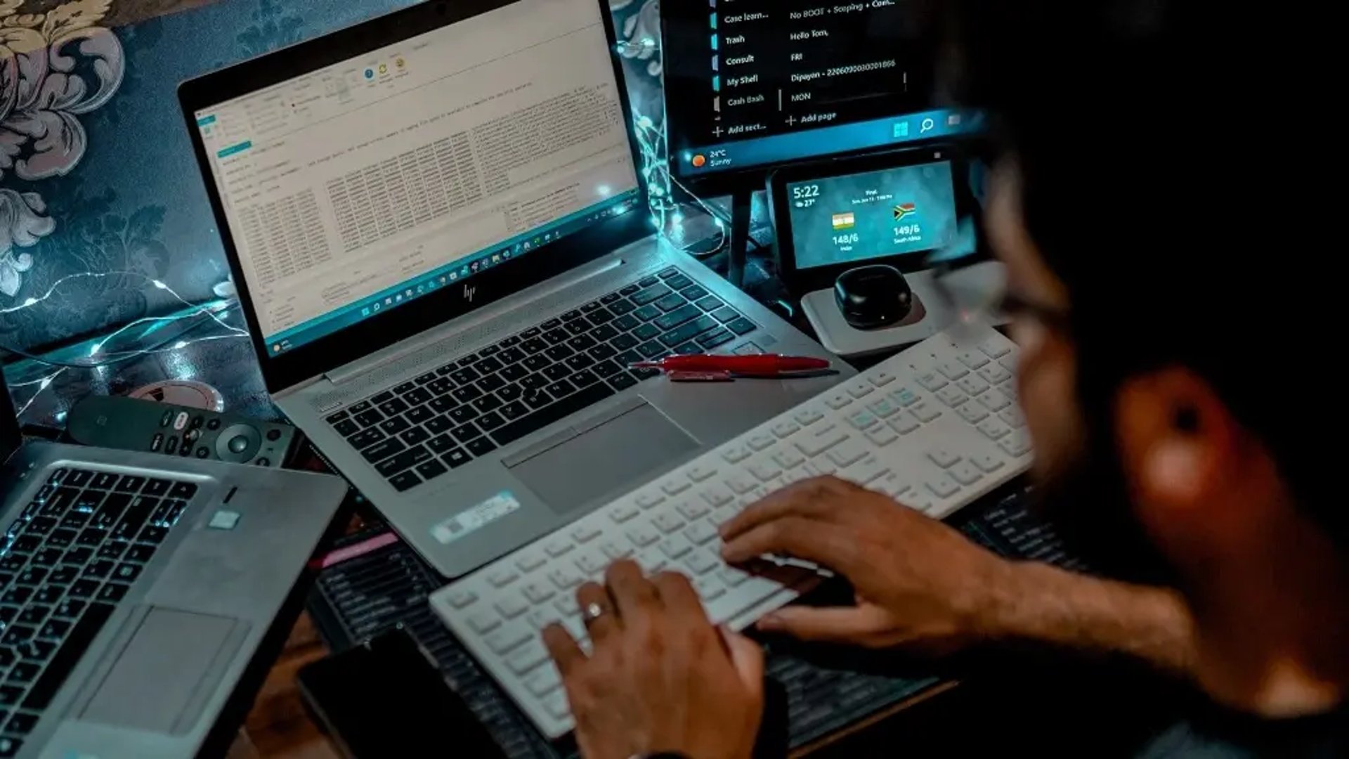 a desk with a chair and a vase of flowers