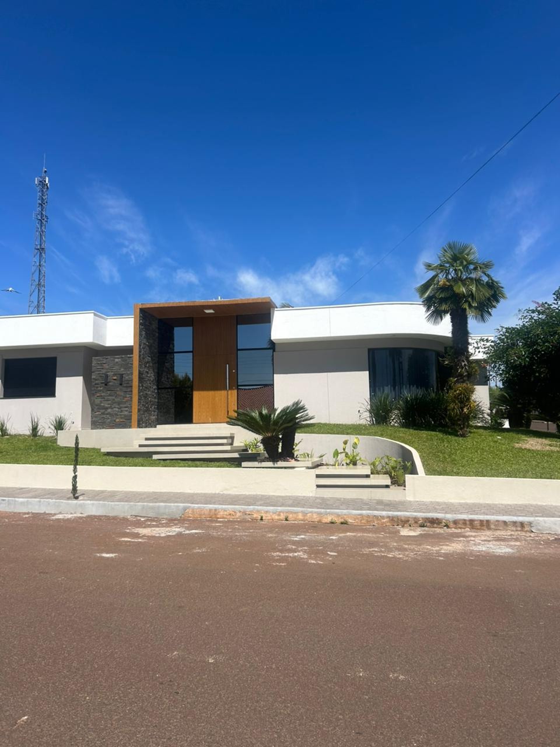 A curved facade covered in white latticework