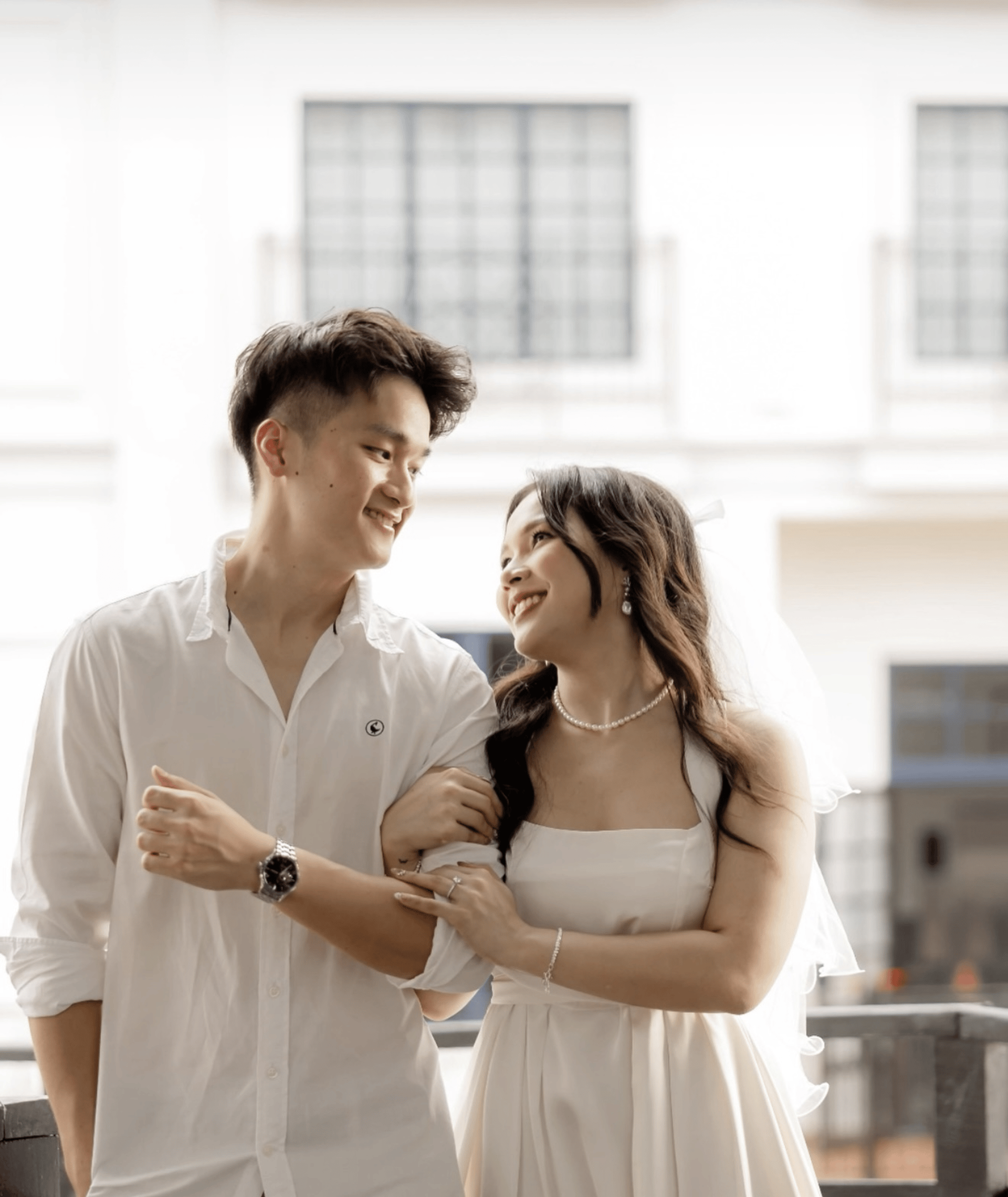 an abstract photo of a curved building with a blue sky in the background