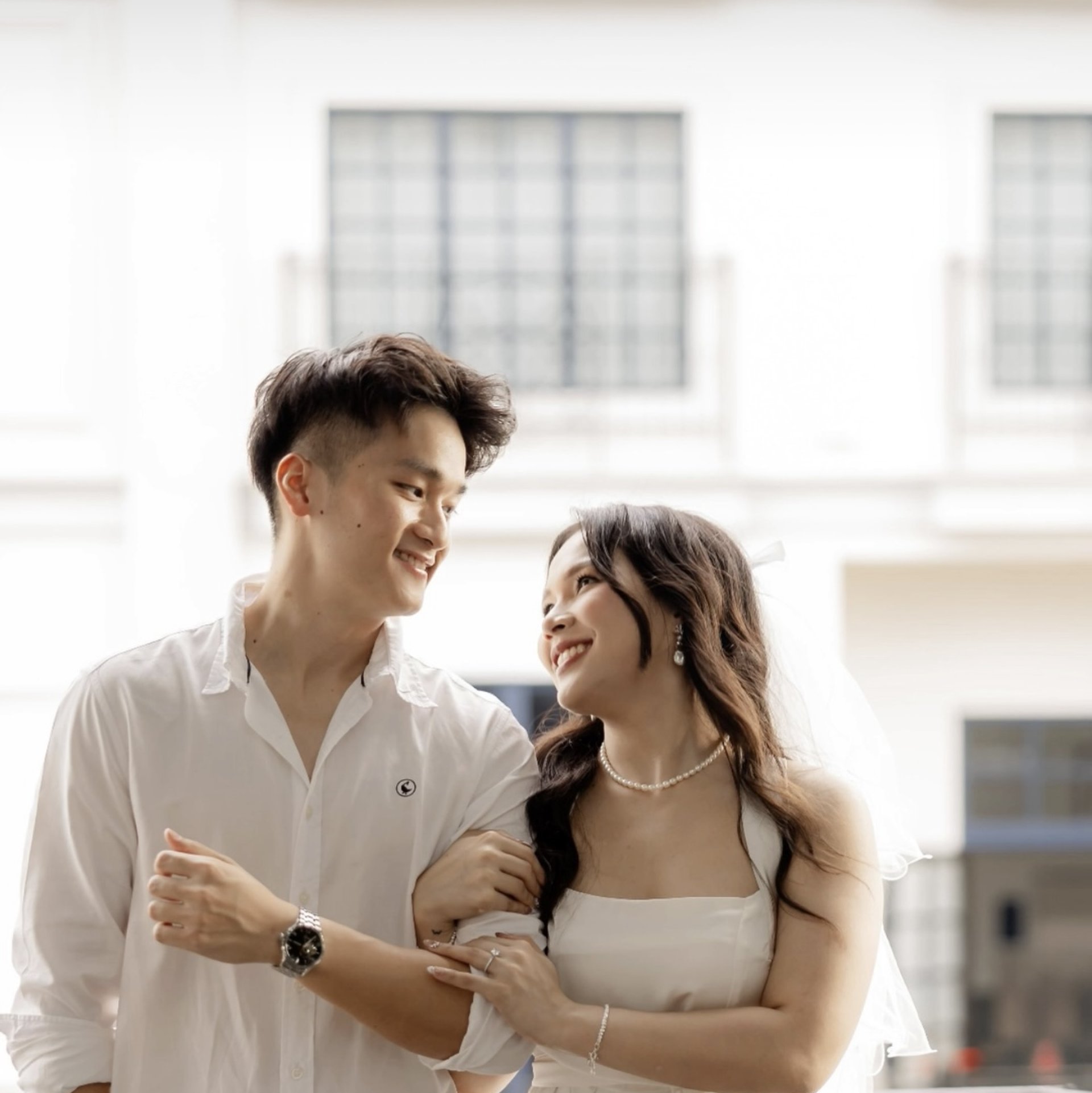 an abstract photo of a curved building with a blue sky in the background