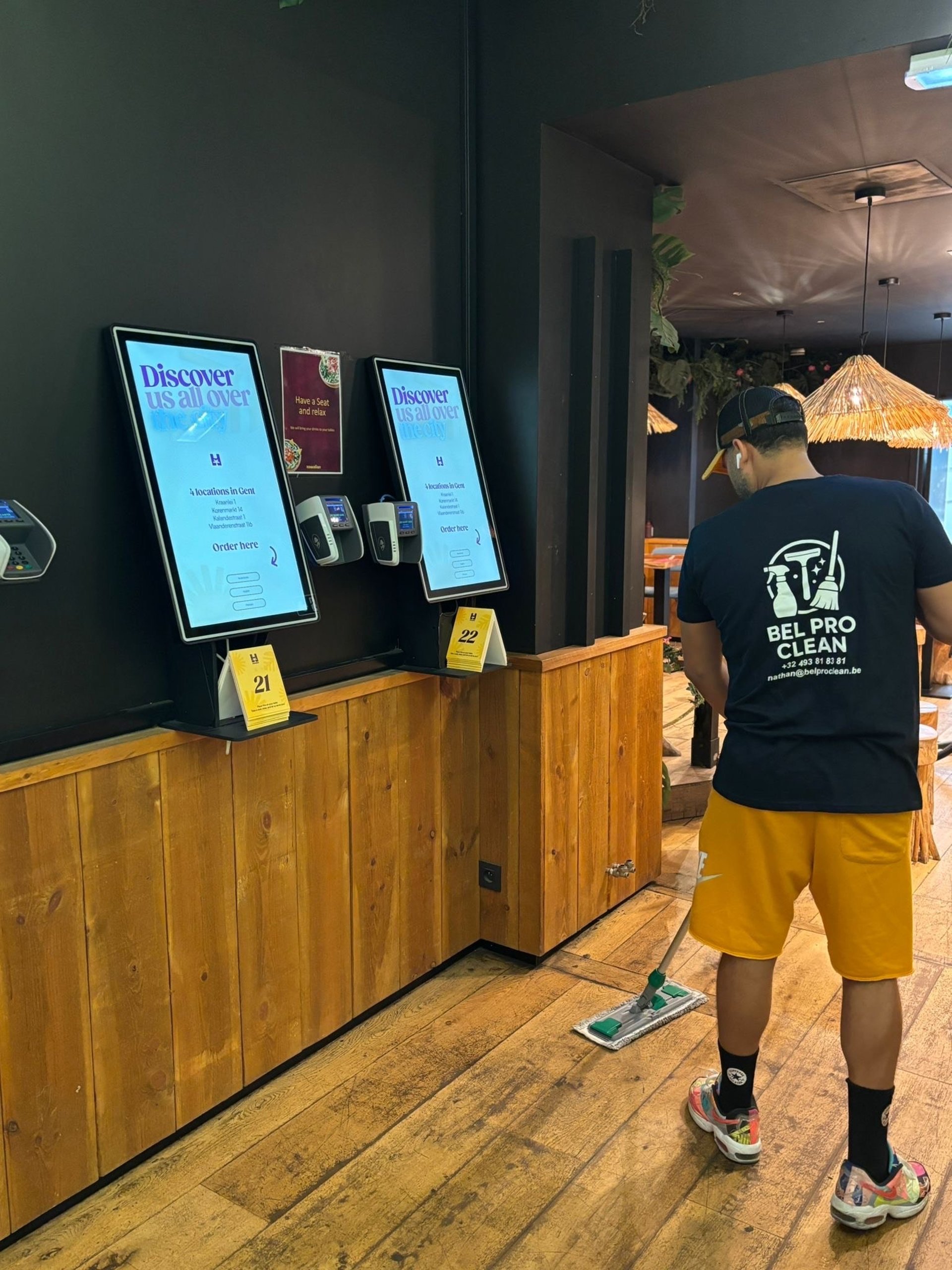 silhouette of man standing near glass window during daytime