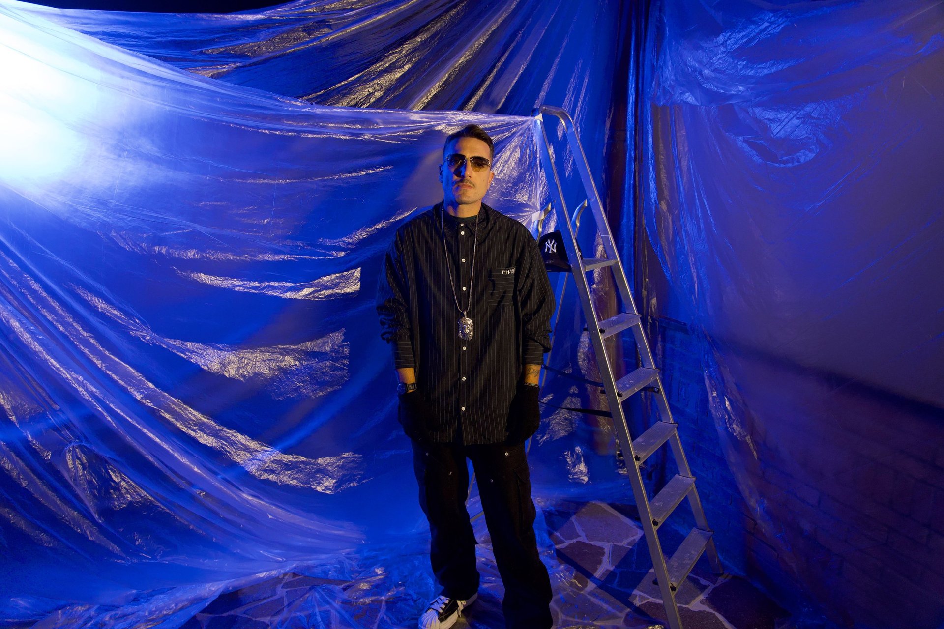 an abstract photo of a curved building with a blue sky in the background