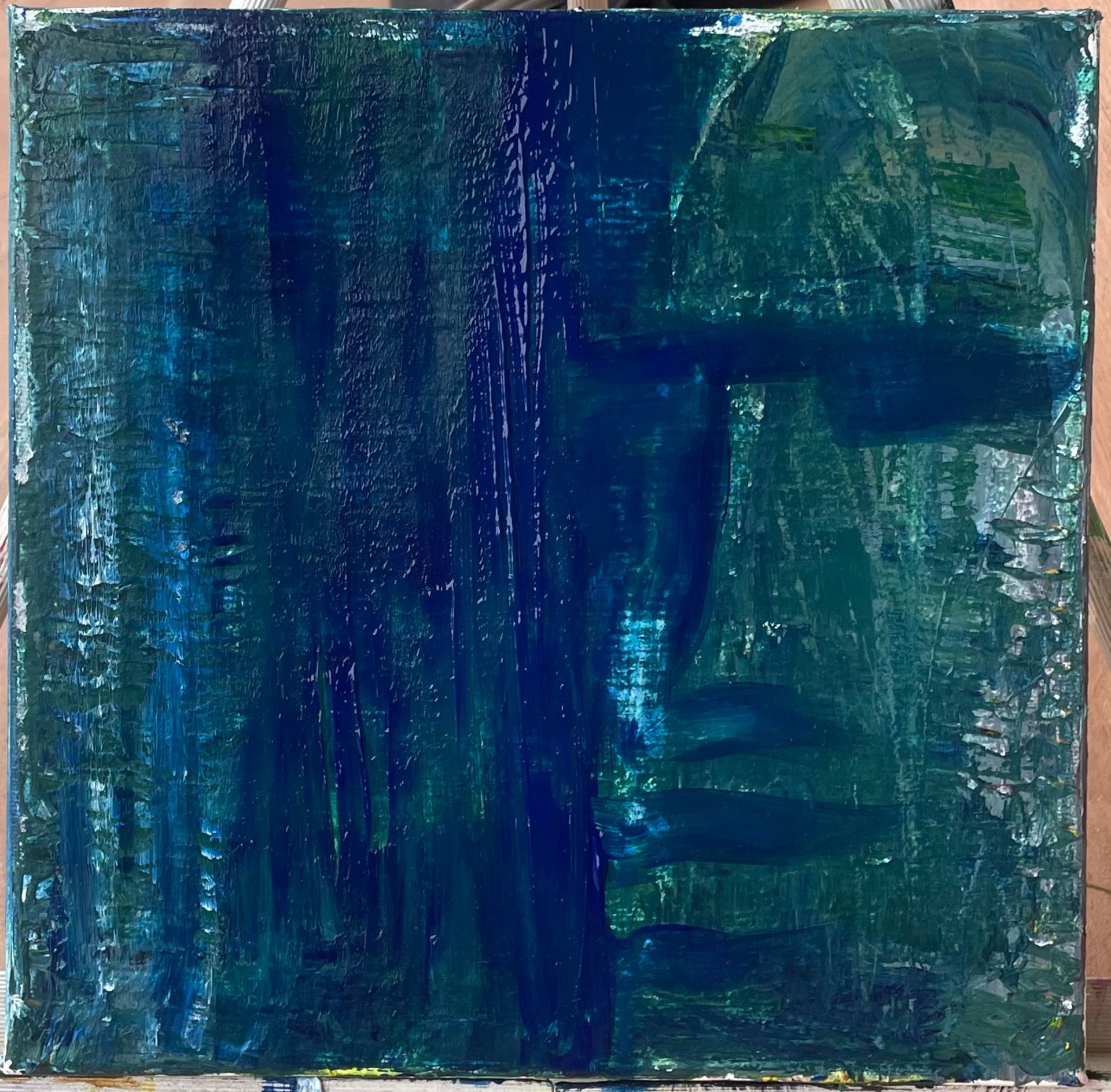 an abstract photo of a curved building with a blue sky in the background