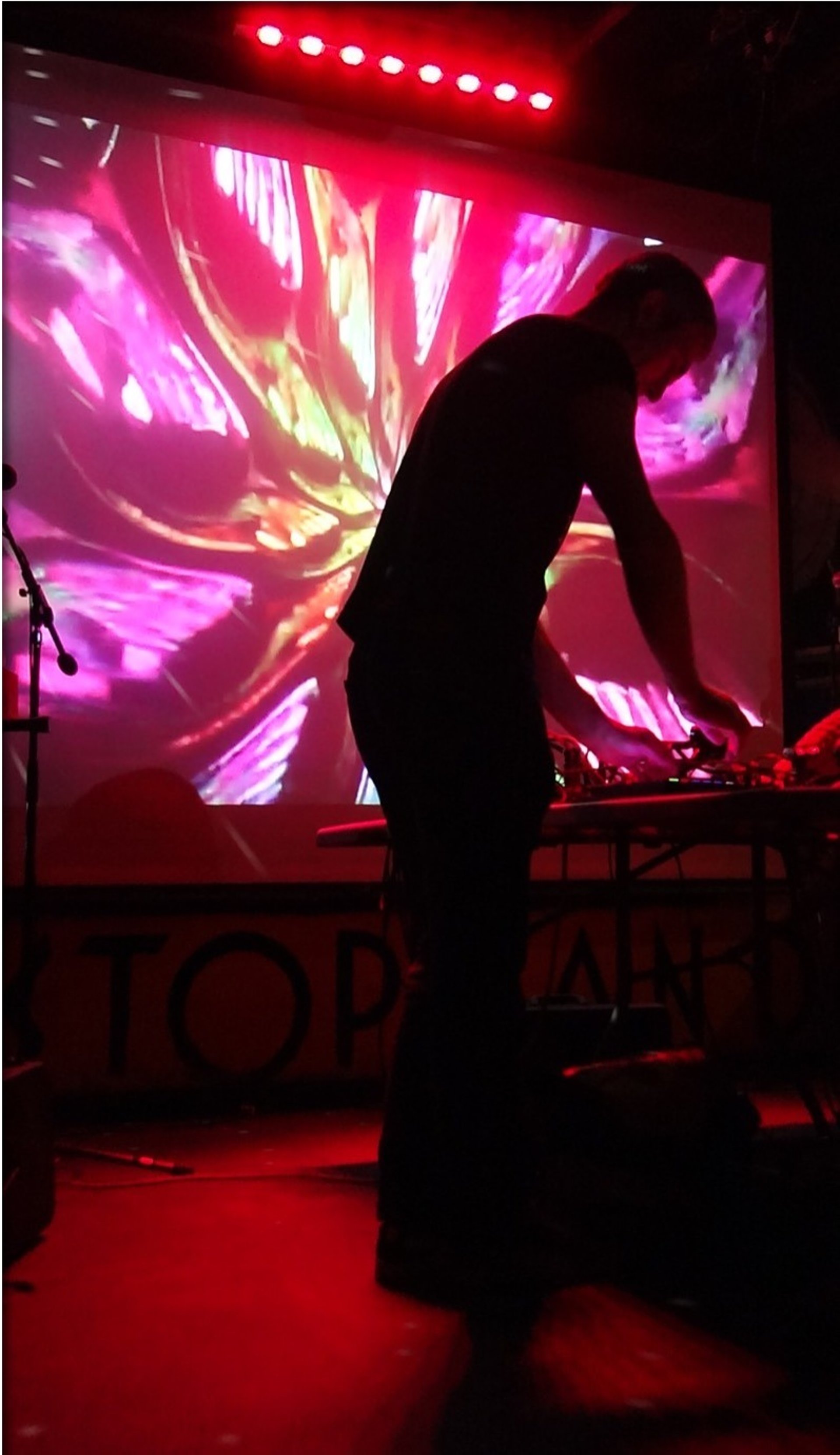 an abstract photo of a curved building with a blue sky in the background