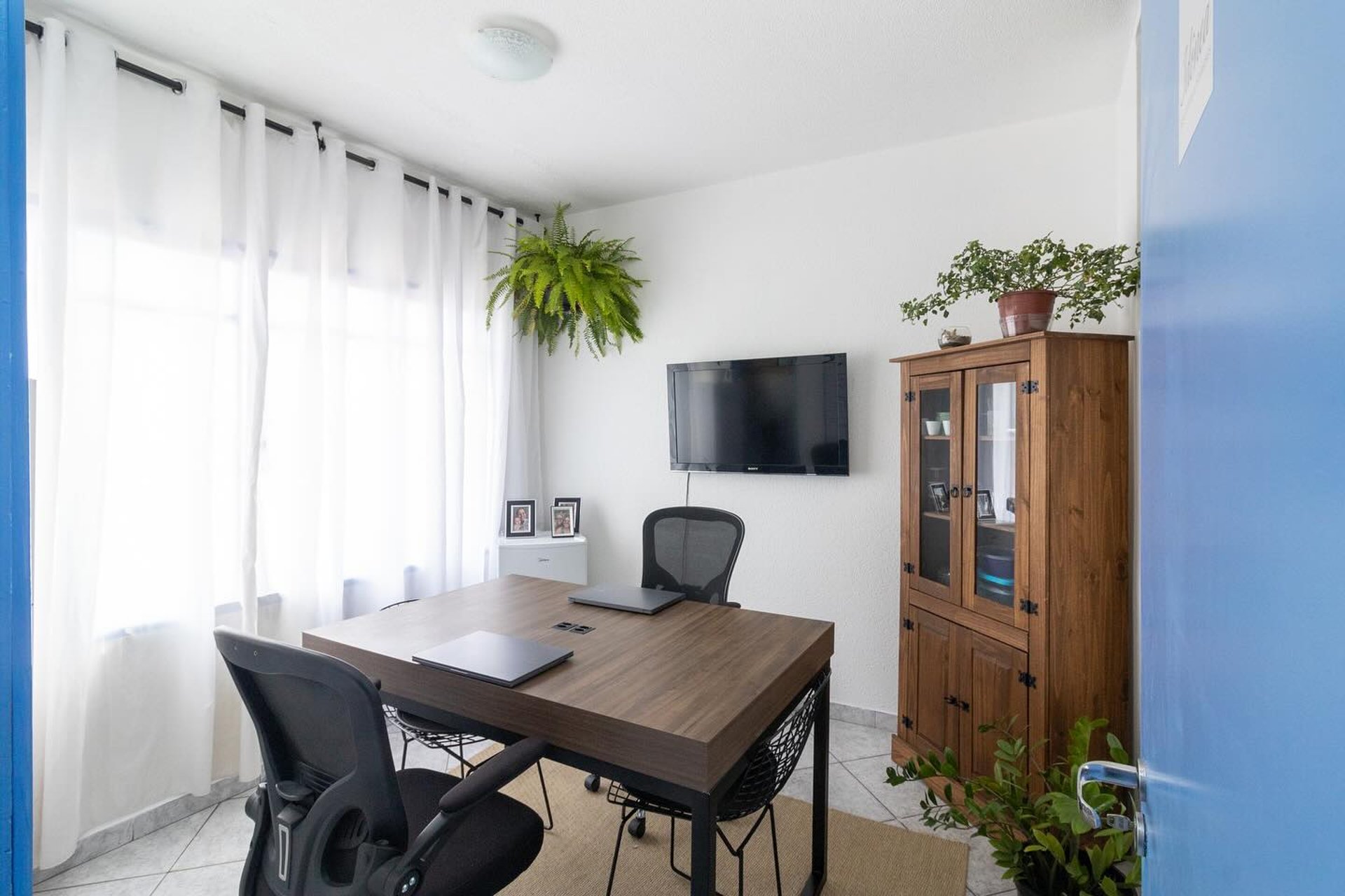 an abstract photo of a curved building with a blue sky in the background