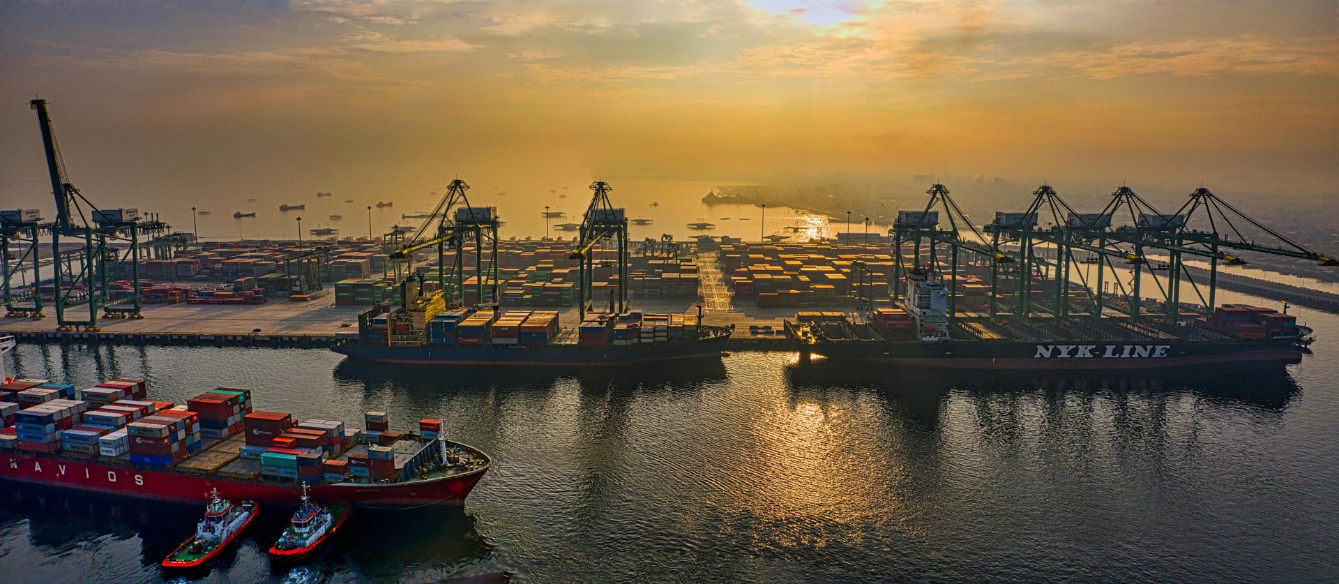 white and brown concrete building near green grass field during daytime