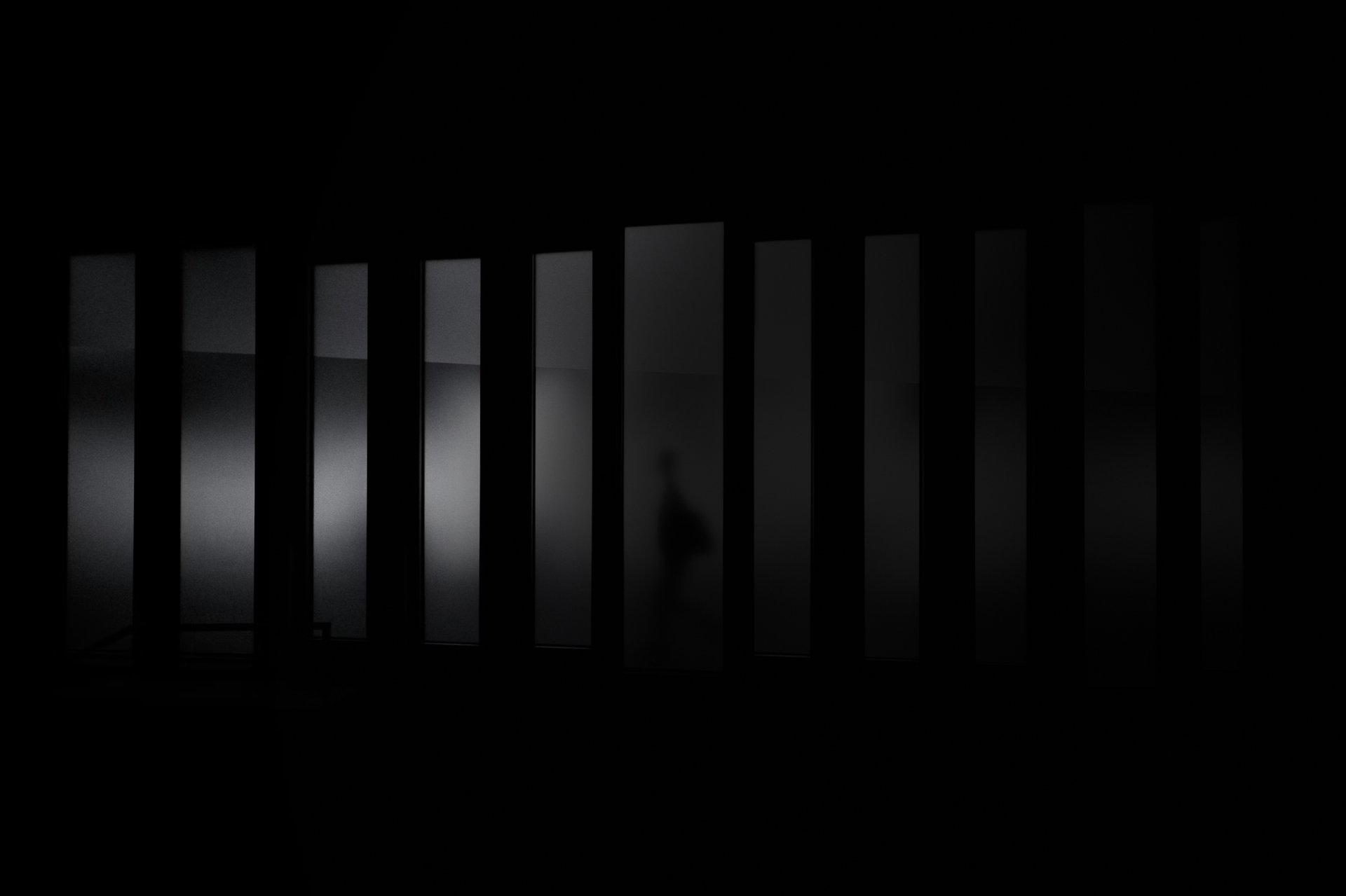 a close up of a black and brown abstract painting