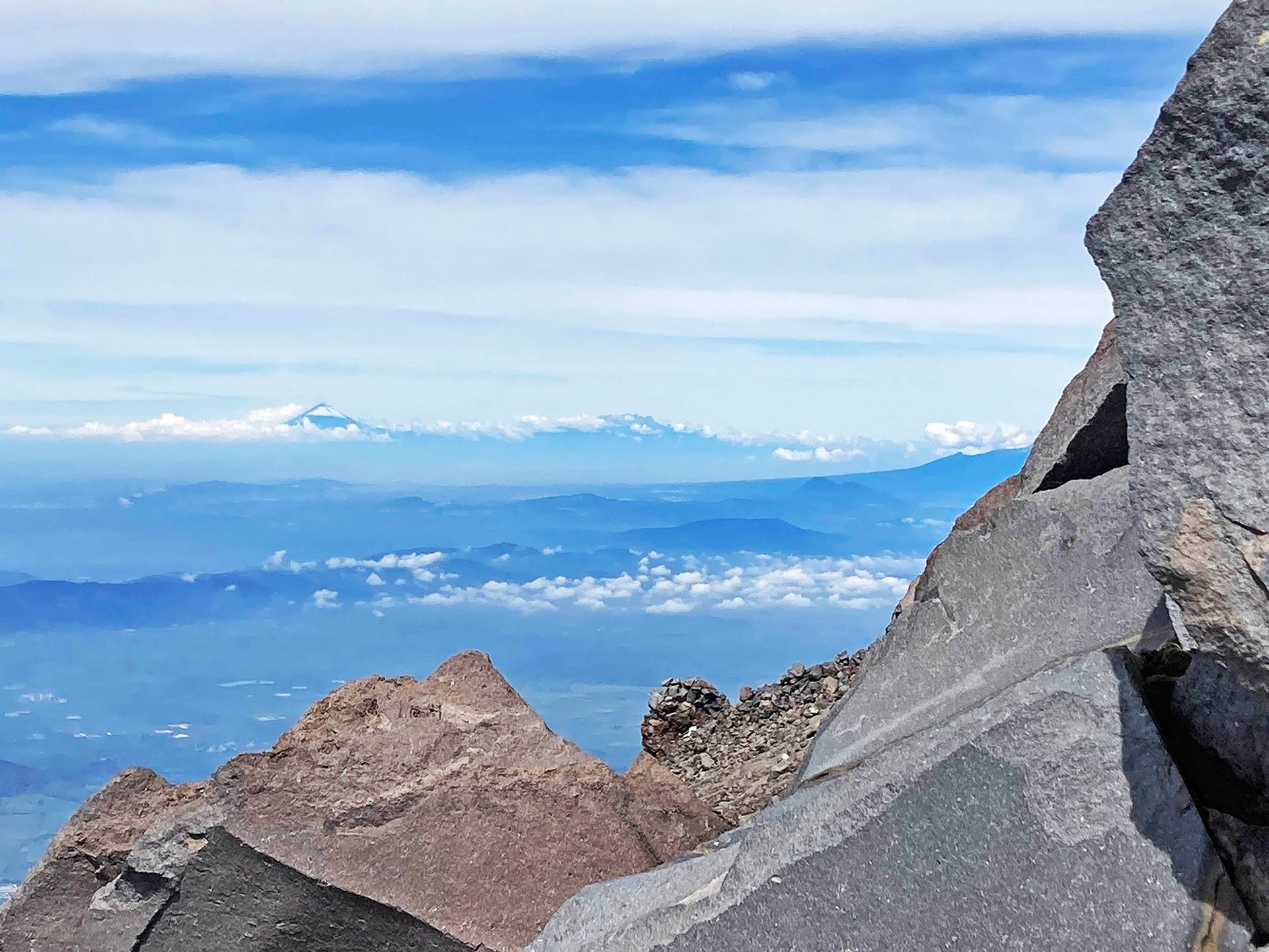 Popocatépetl and Iztaccíhuatl Seen on the Distant Horizon from Pico de Orizaba, Puebla, Mexico