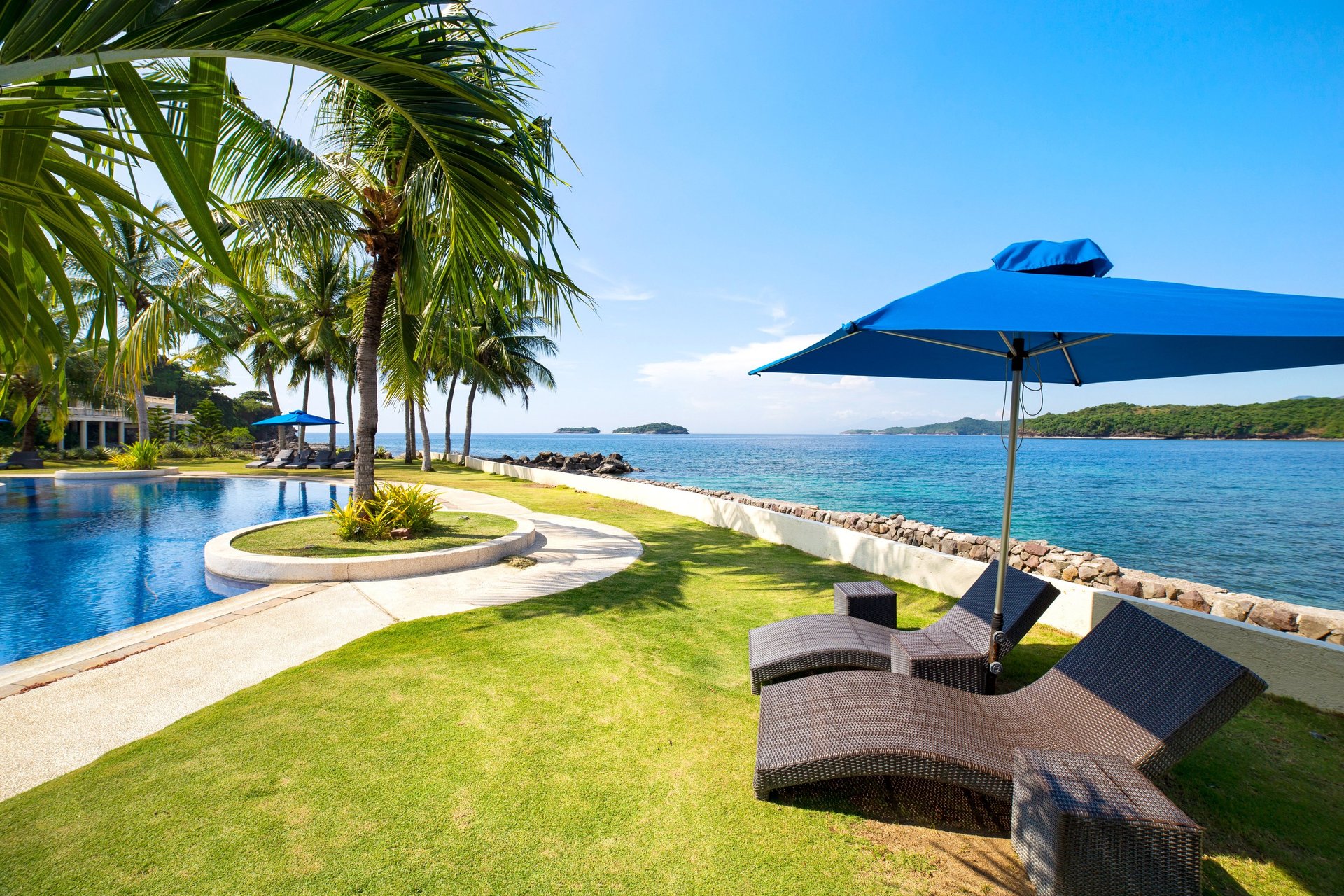an abstract photo of a curved building with a blue sky in the background