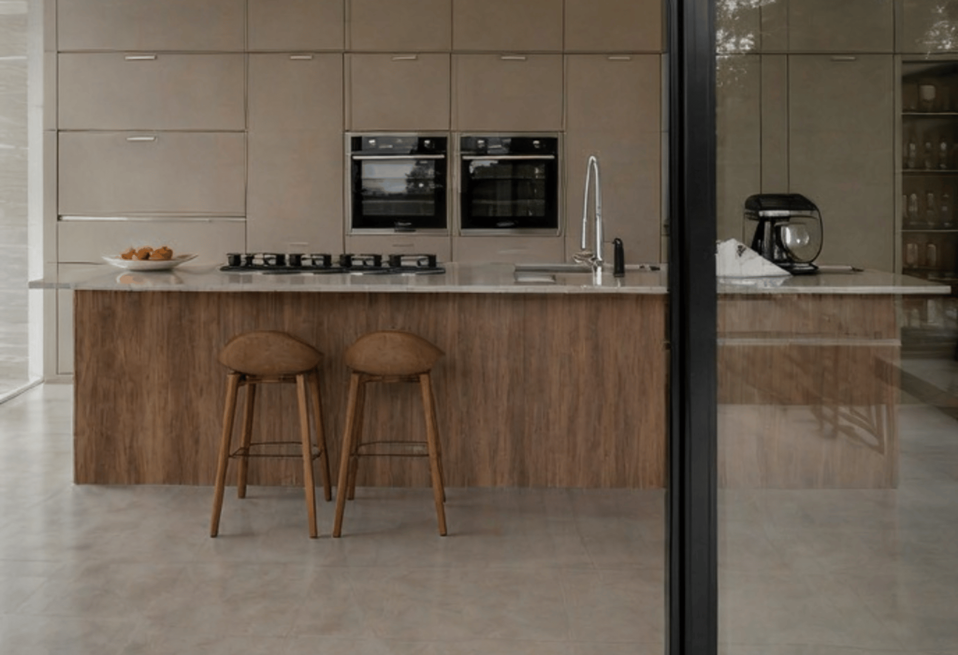 an abstract photo of a curved building with a blue sky in the background
