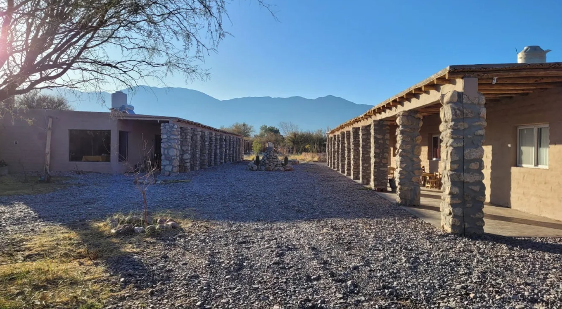 woman wearing yellow long-sleeved dress under white clouds and blue sky during daytime