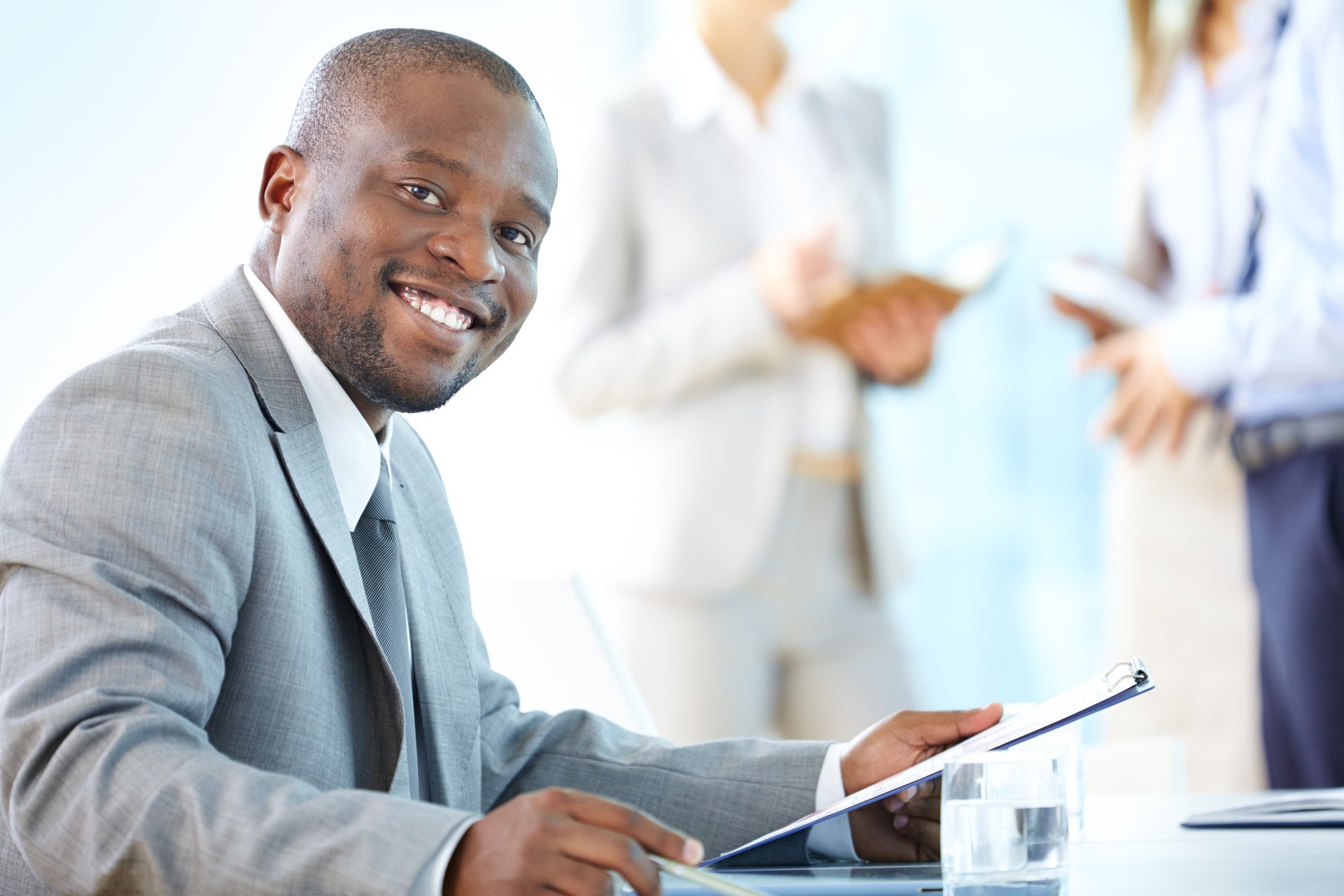 an abstract photo of a curved building with a blue sky in the background