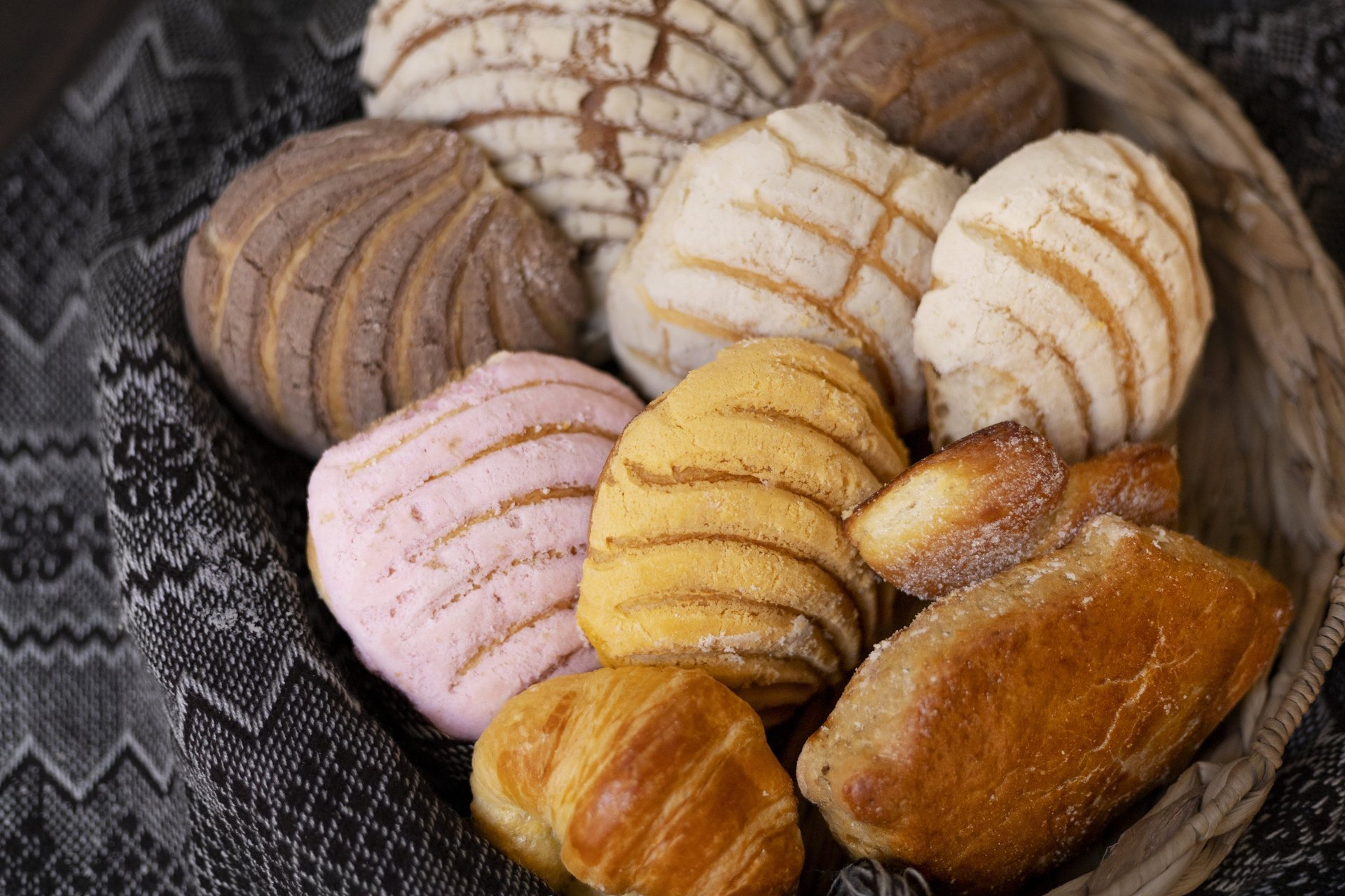 an abstract photo of a curved building with a blue sky in the background