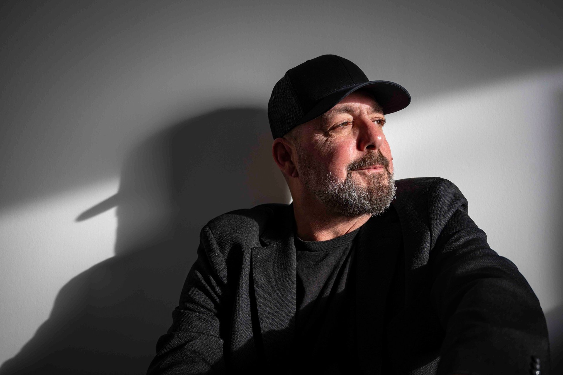 black and brown leather padded tub sofa