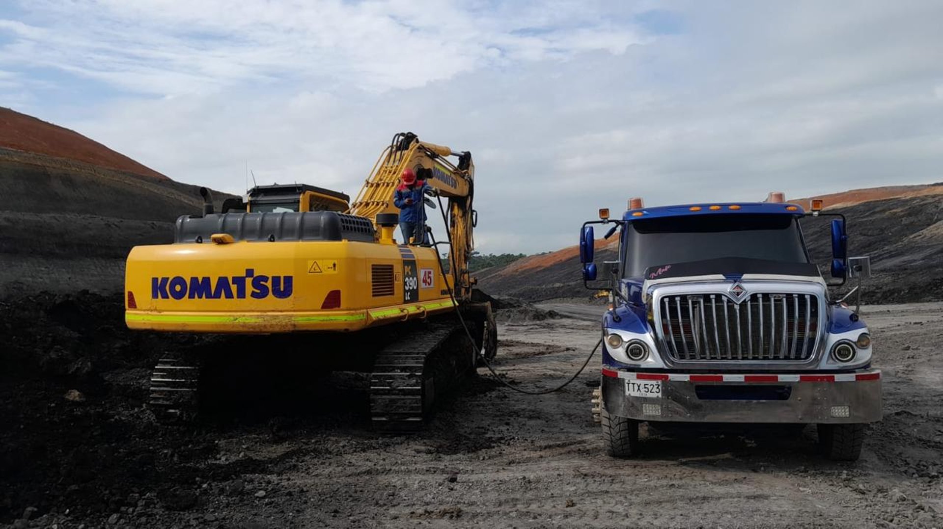 woman wearing yellow long-sleeved dress under white clouds and blue sky during daytime