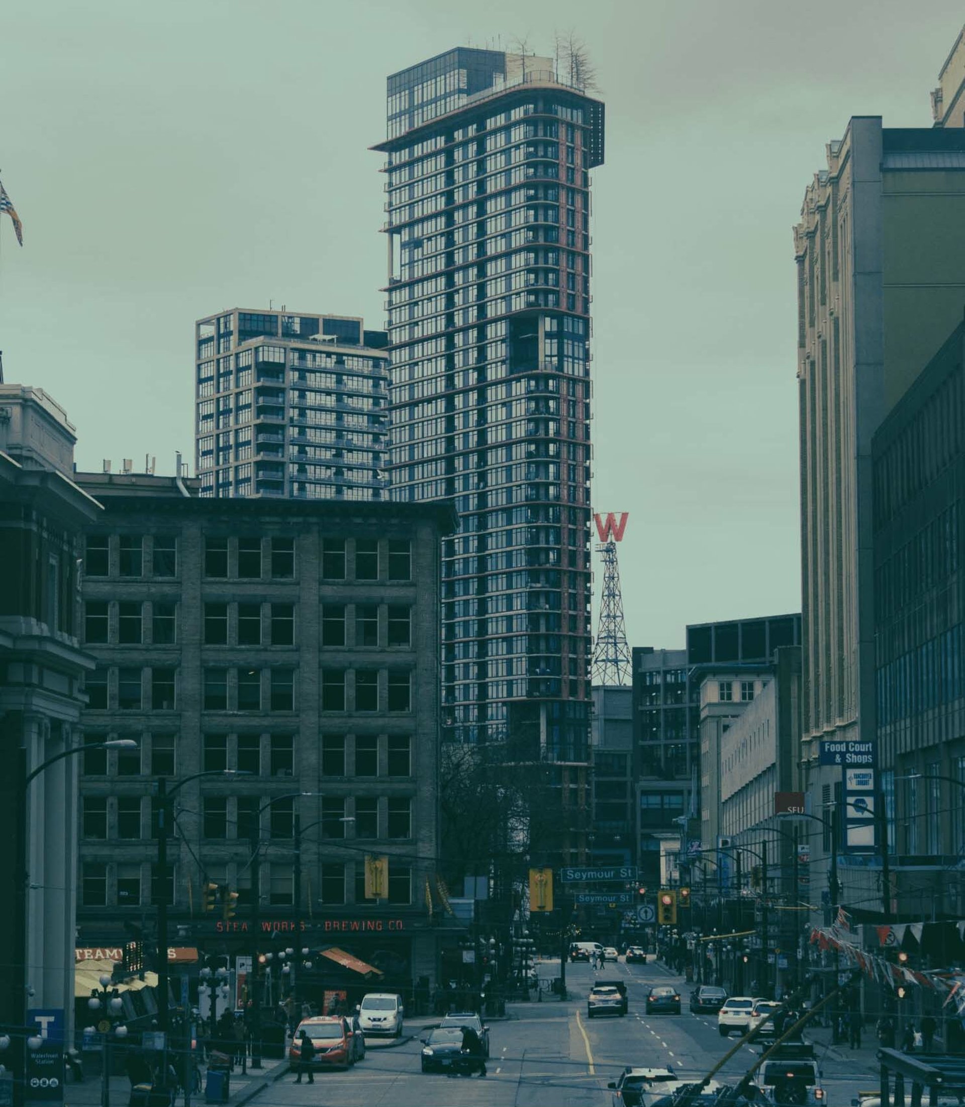 an abstract photo of a curved building with a blue sky in the background