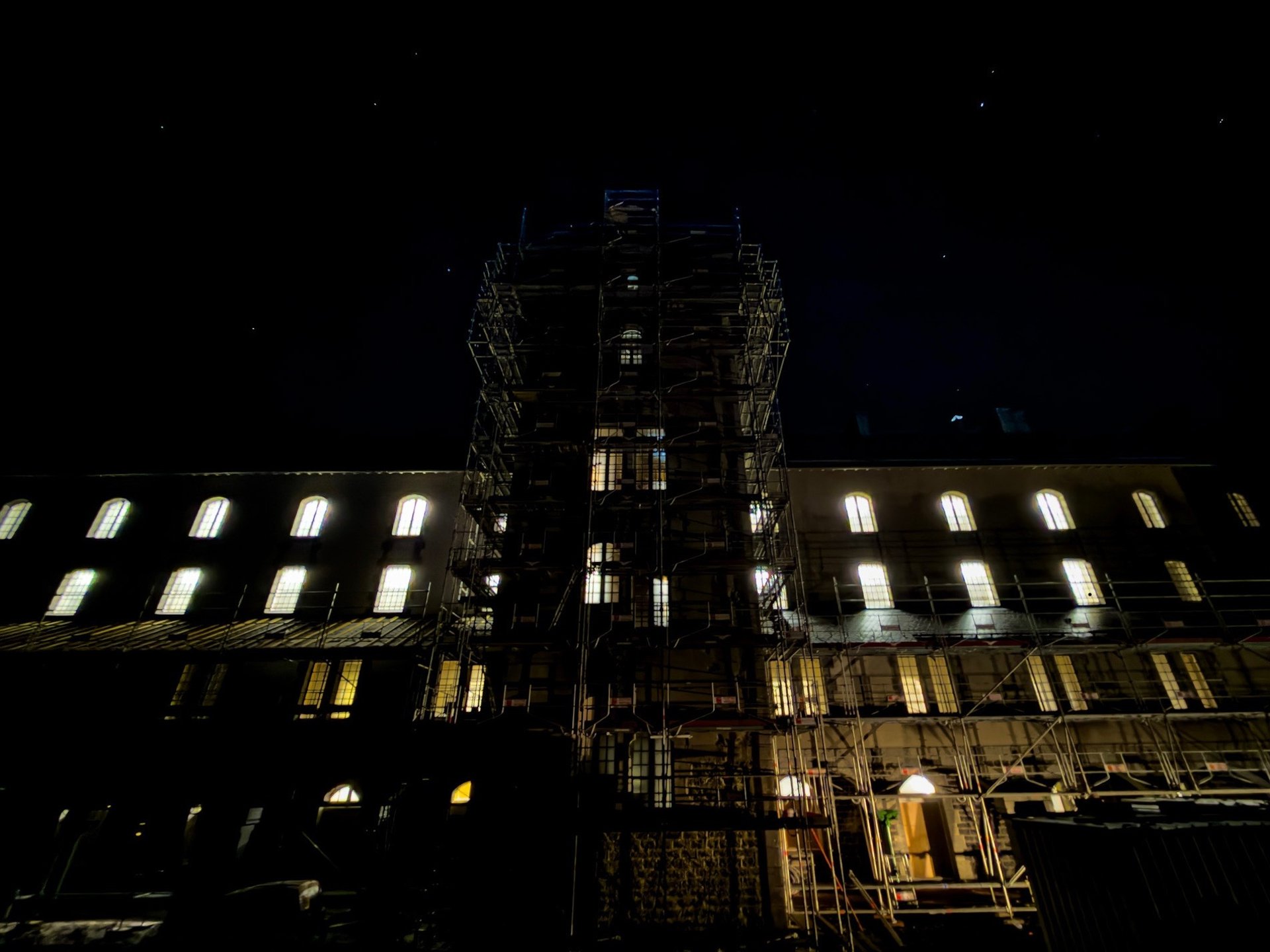 woman wearing yellow long-sleeved dress under white clouds and blue sky during daytime