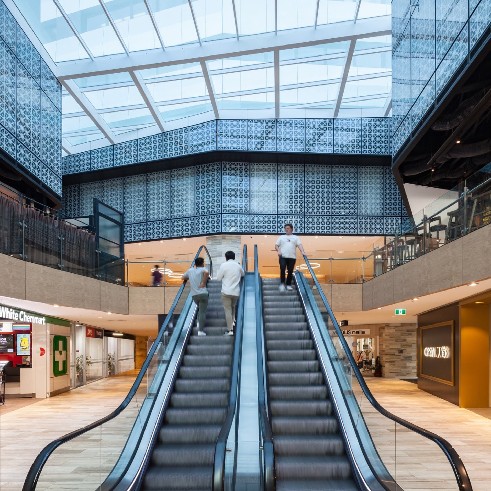 an abstract photo of a curved building with a blue sky in the background