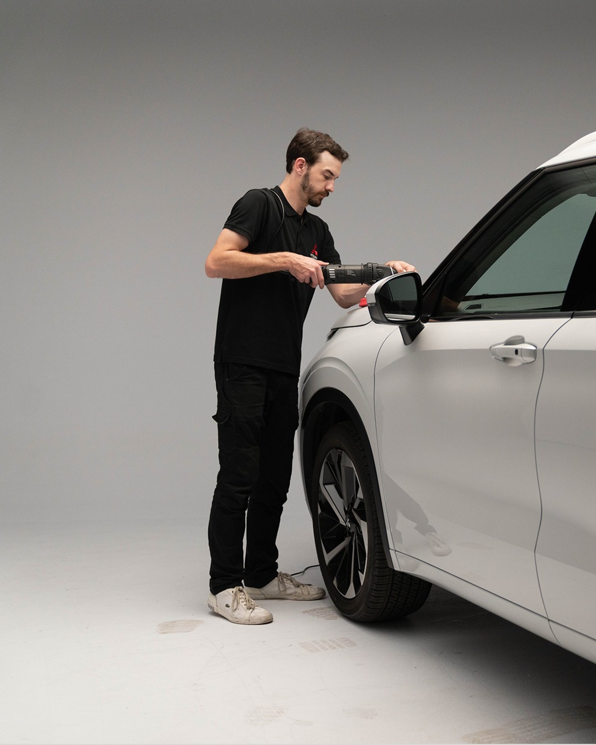 an abstract photo of a curved building with a blue sky in the background
