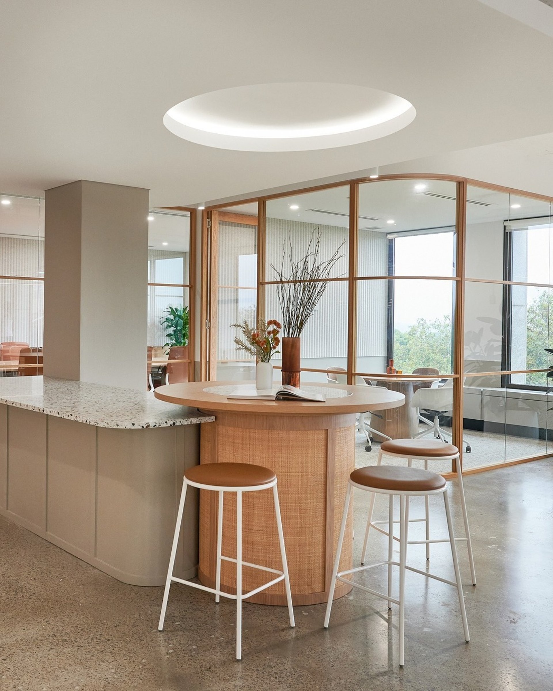 an abstract photo of a curved building with a blue sky in the background